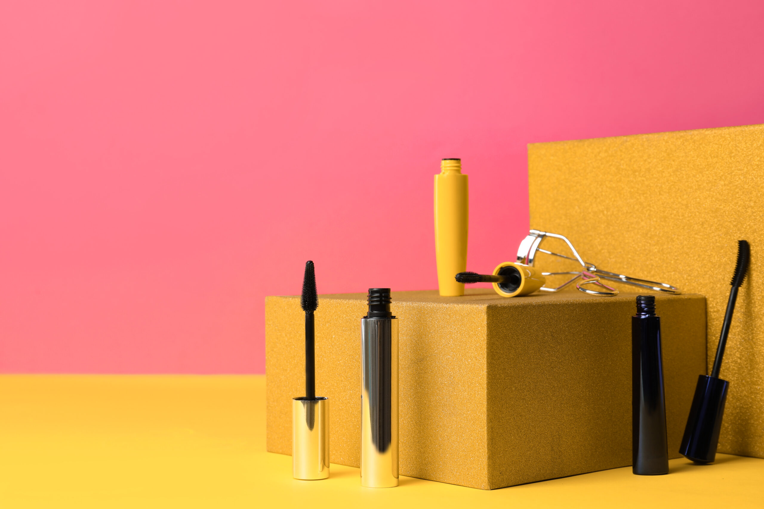 different mascaras and eyelash curler on yellow ba 2026 03 27 00 52 43 utc