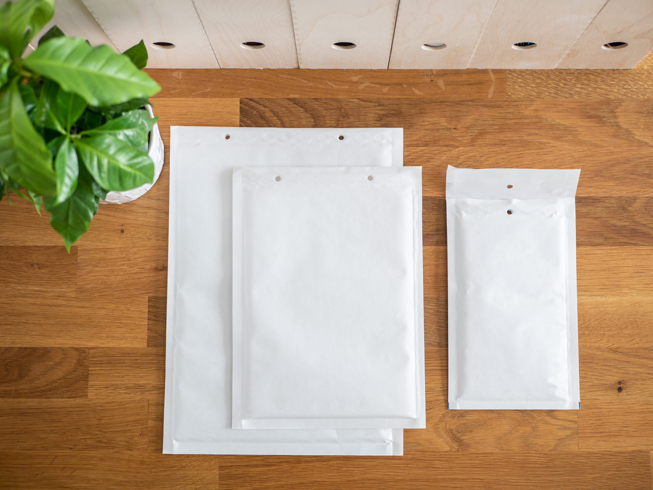 padded mailing envelopes on a wooden desk 2026 03 26 07 46 08 utc