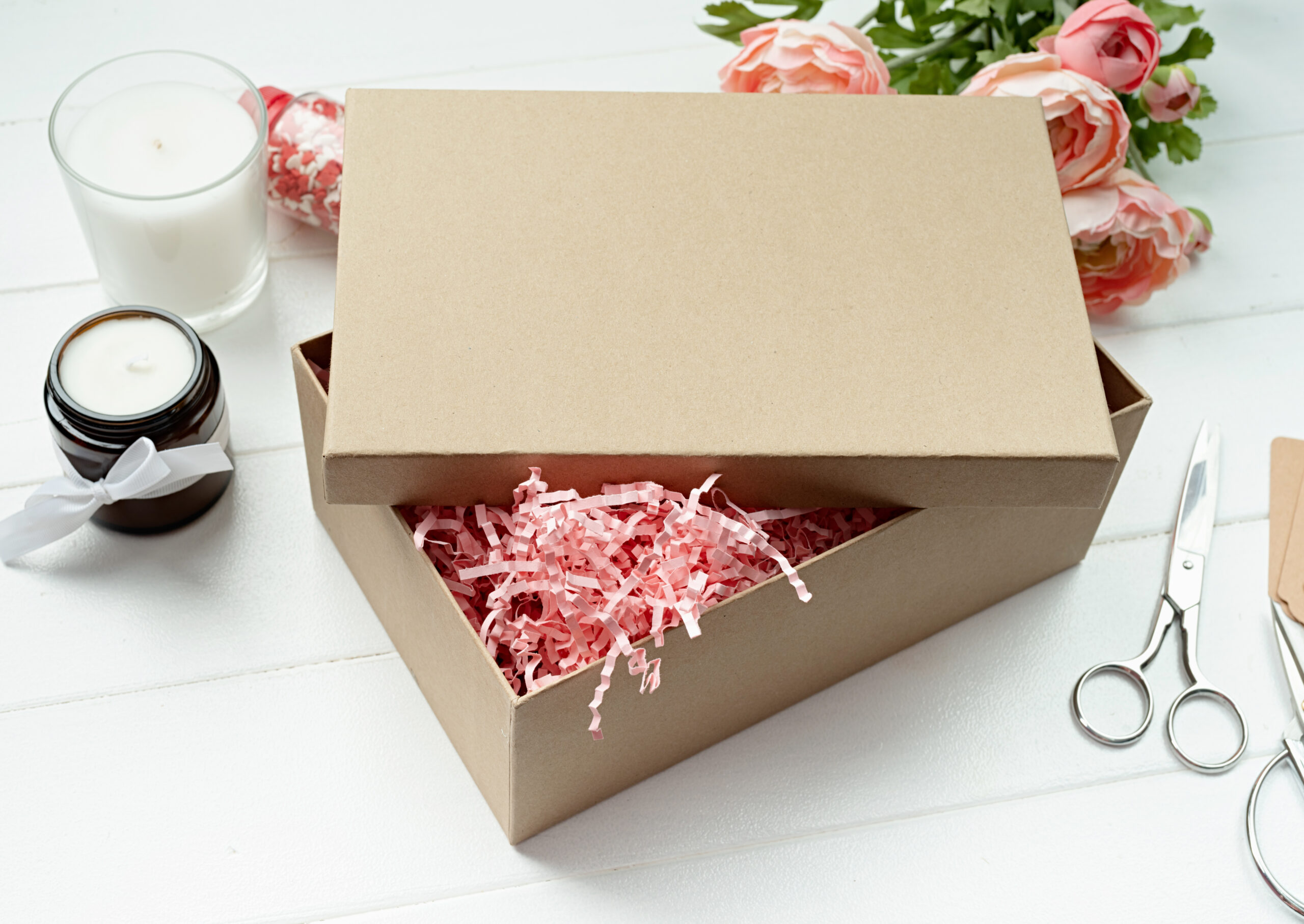 gift box with candle and flowers on table 2026 03 25 00 12 42 utc