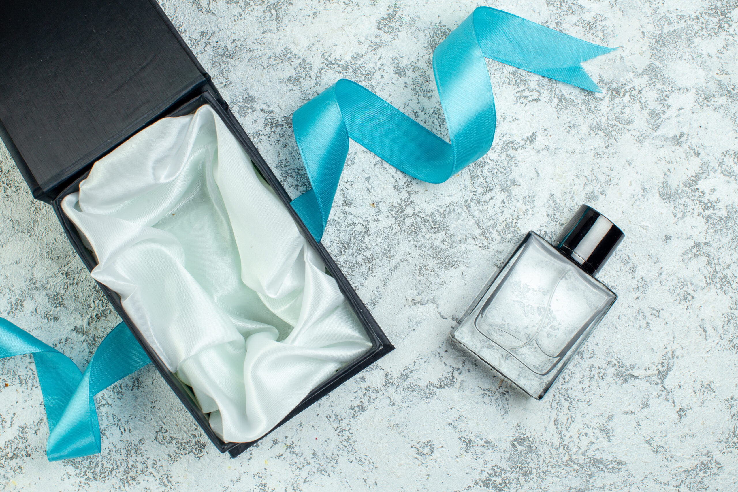 top view perfume bottle blue ribbon perfume box on 2026 03 18 09 56 45 utc