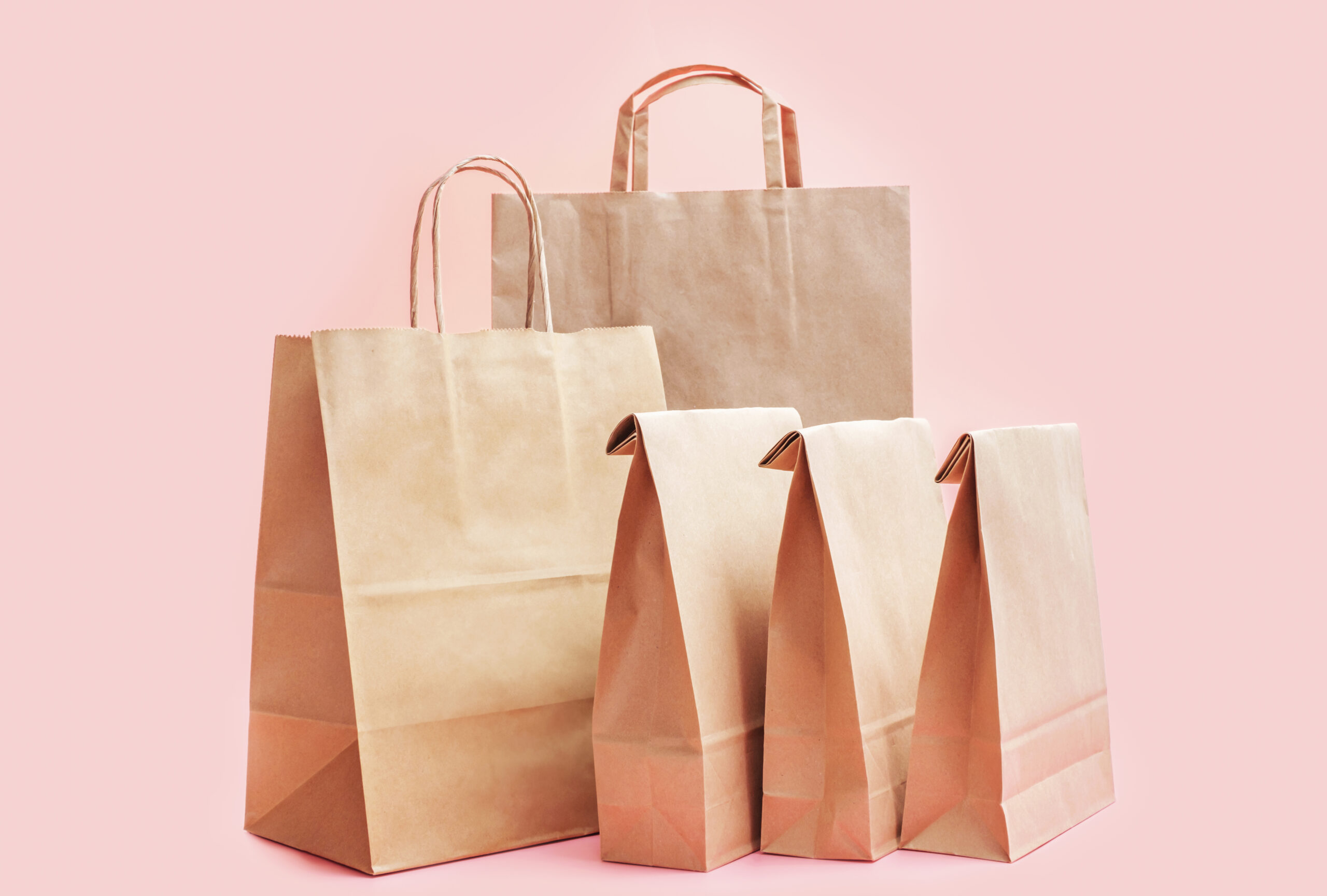 brown eco bags on pink background close up concep 2026 01 07 00 22 25 utc