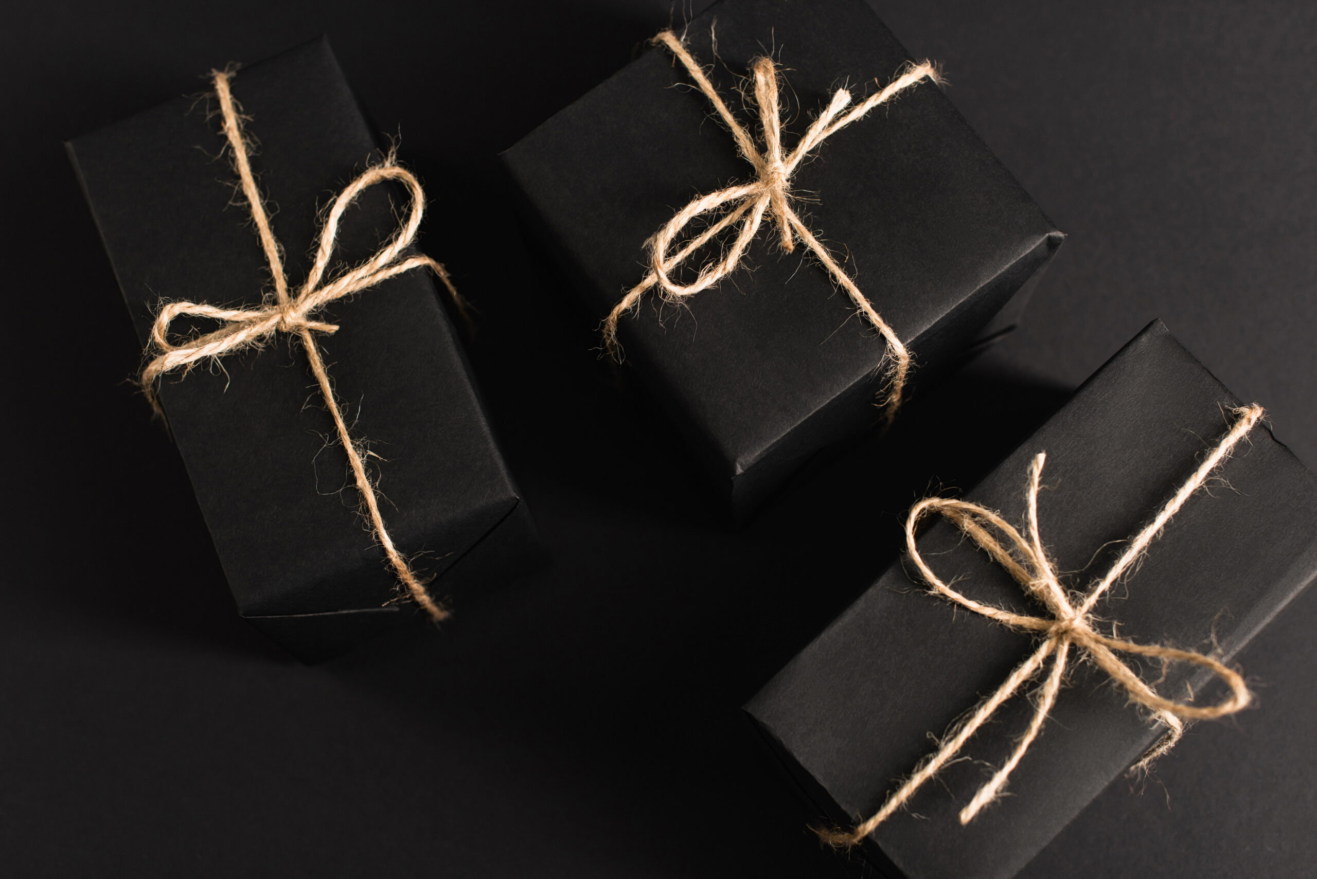 top view of wrapped dark gift boxes on black 2026 01 05 23 39 29 utc