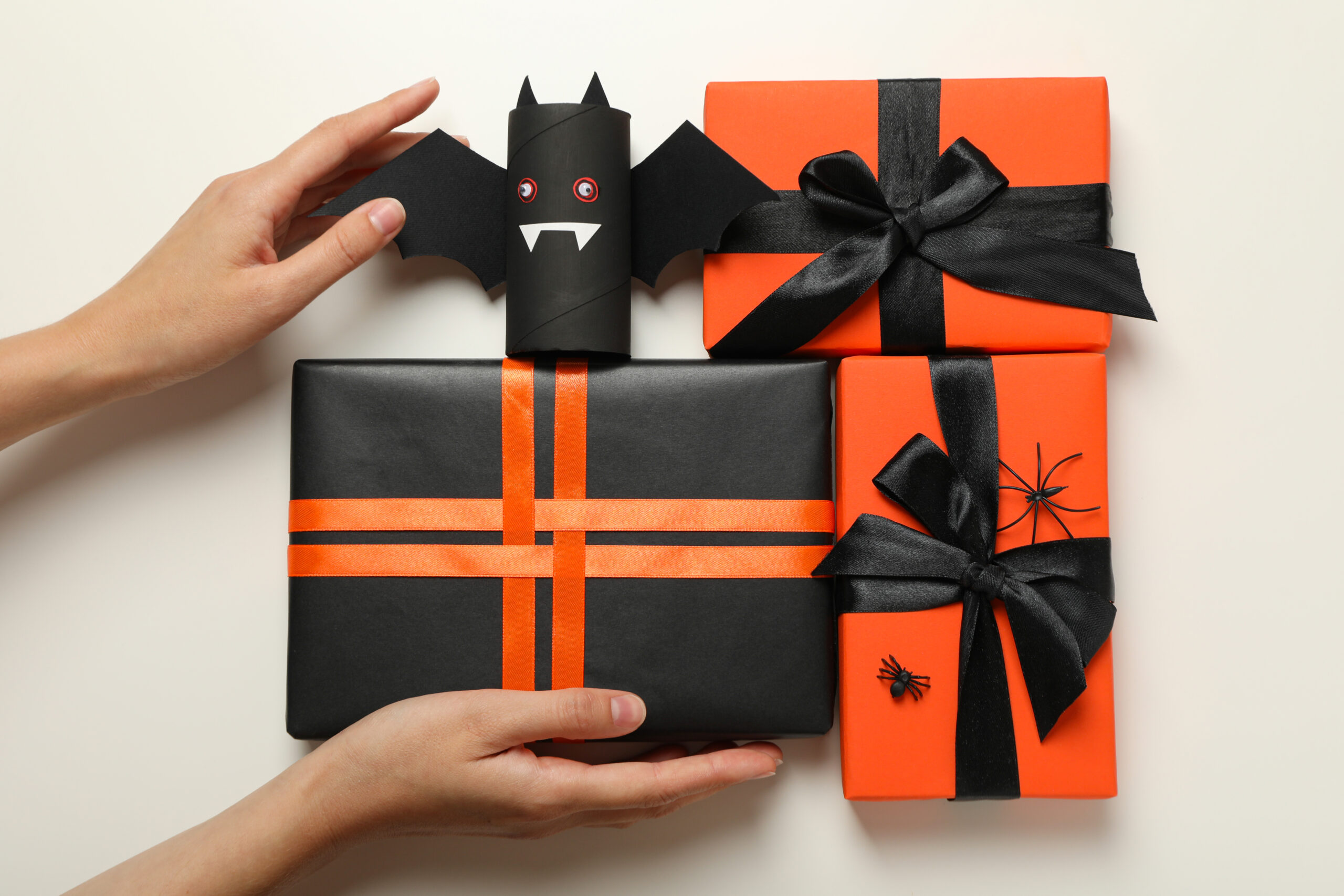 gift boxes paper bat and hands on white backgroun 2026 03 24 23 11 58 utc