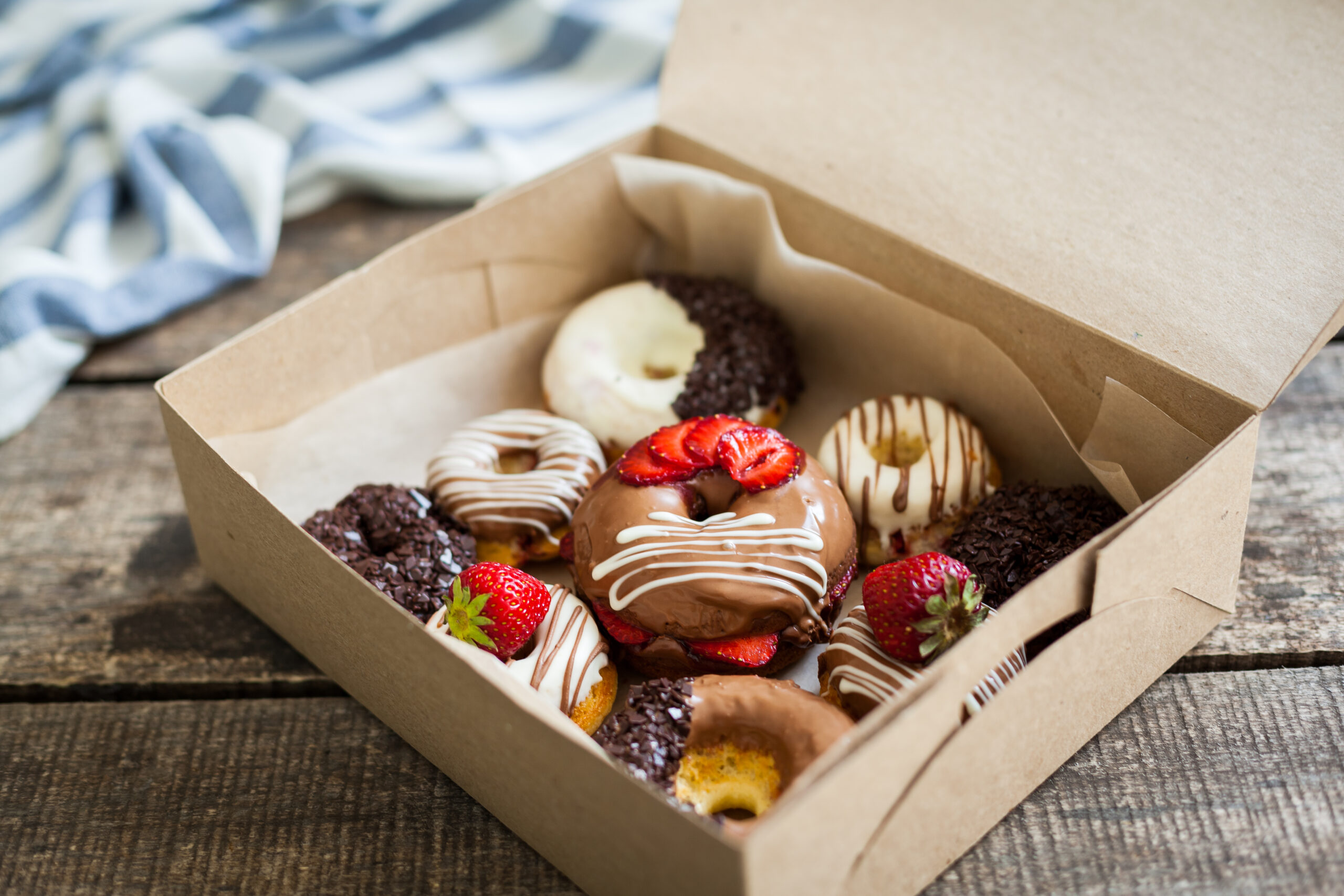 colorful donuts in box 2026 01 08 06 02 32 utc
