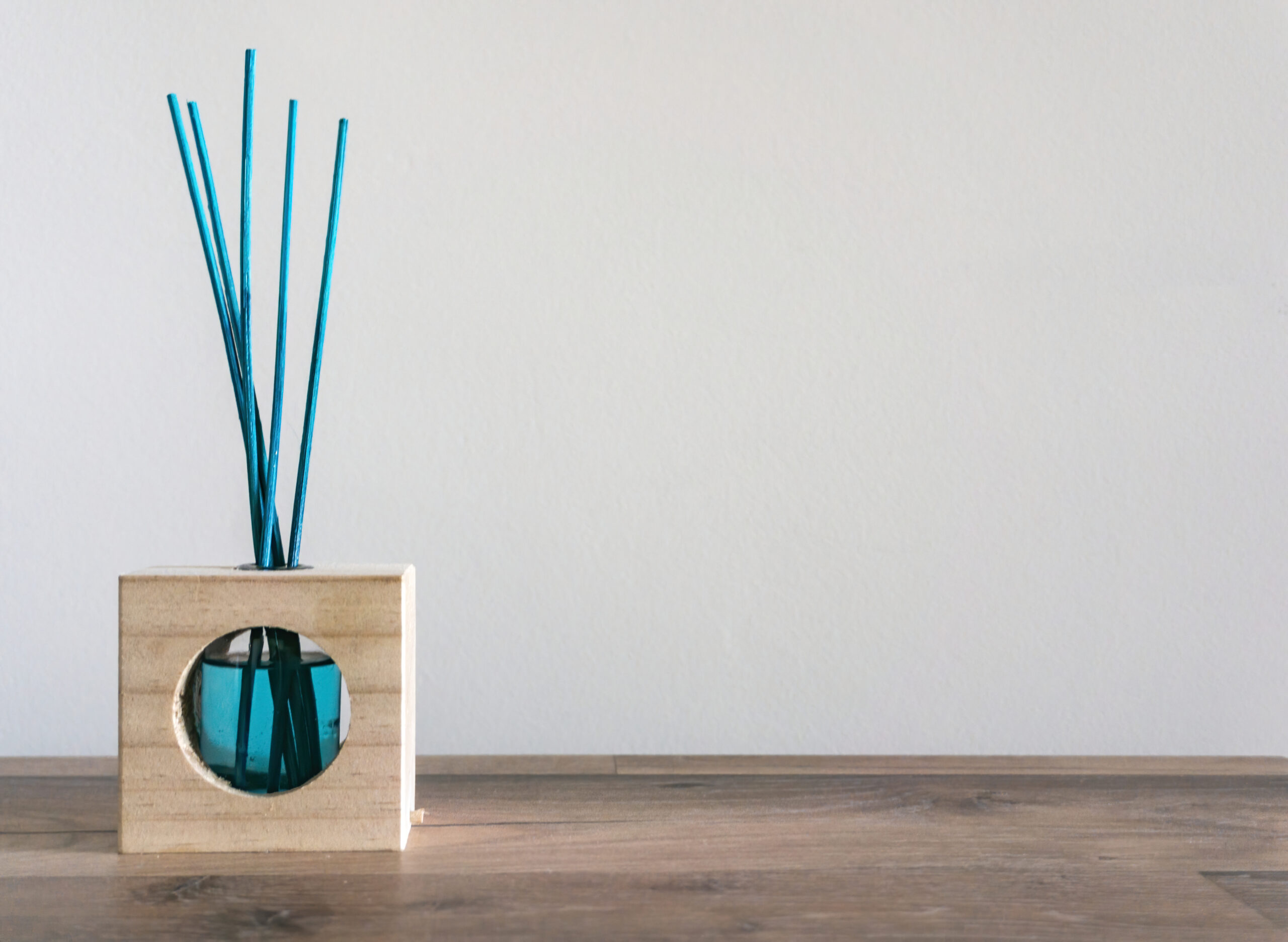 closeup of a blue air freshener with reed sticks o 2026 03 18 16 20 33 utc
