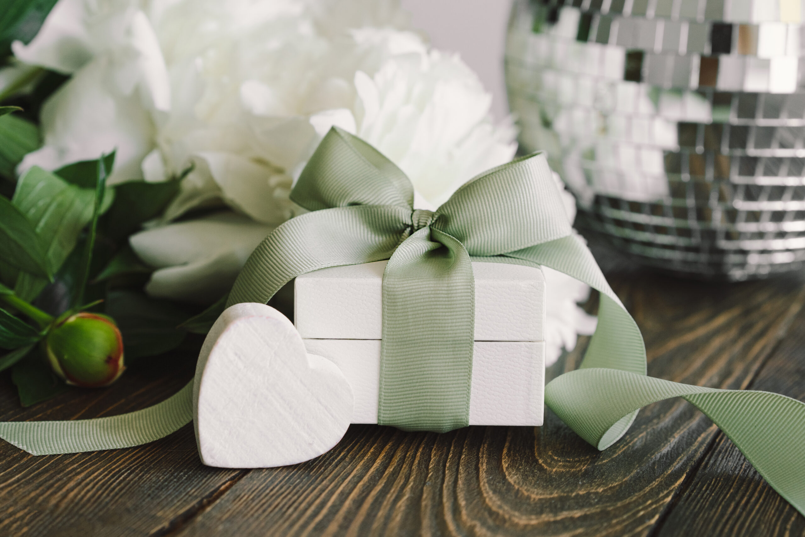 elegant gift with ribbon and flowers on table 2026 03 19 21 56 54 utc