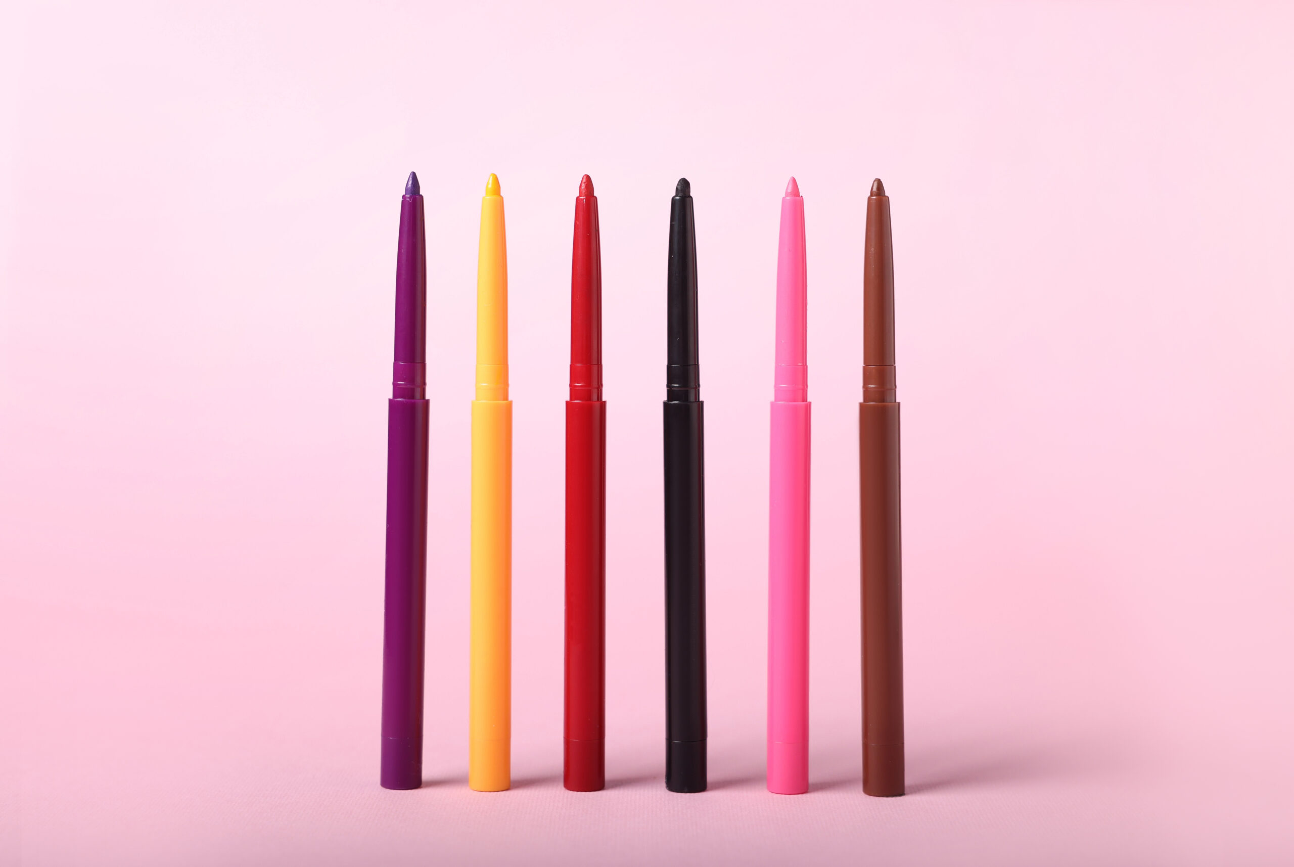 colorful twist up eye pencils on pink background 2026 03 11 04 23 49 utc