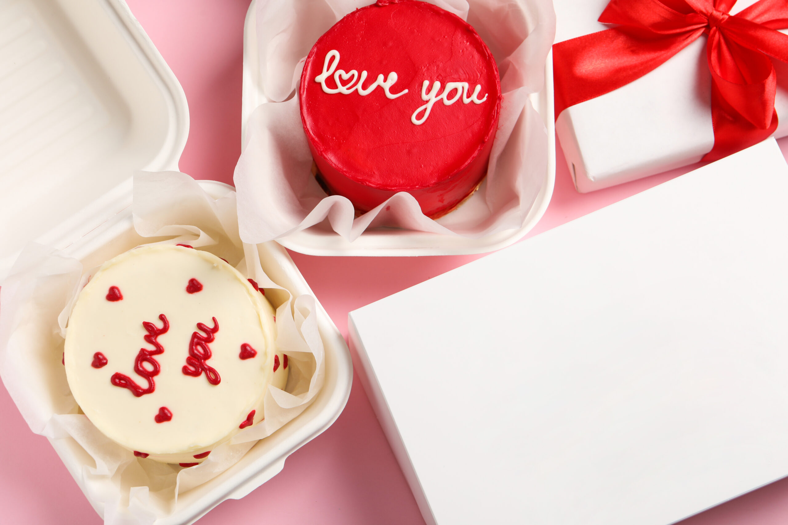 red and white cakes in boxes with gifts 2026 04 08 14 50 07 utc