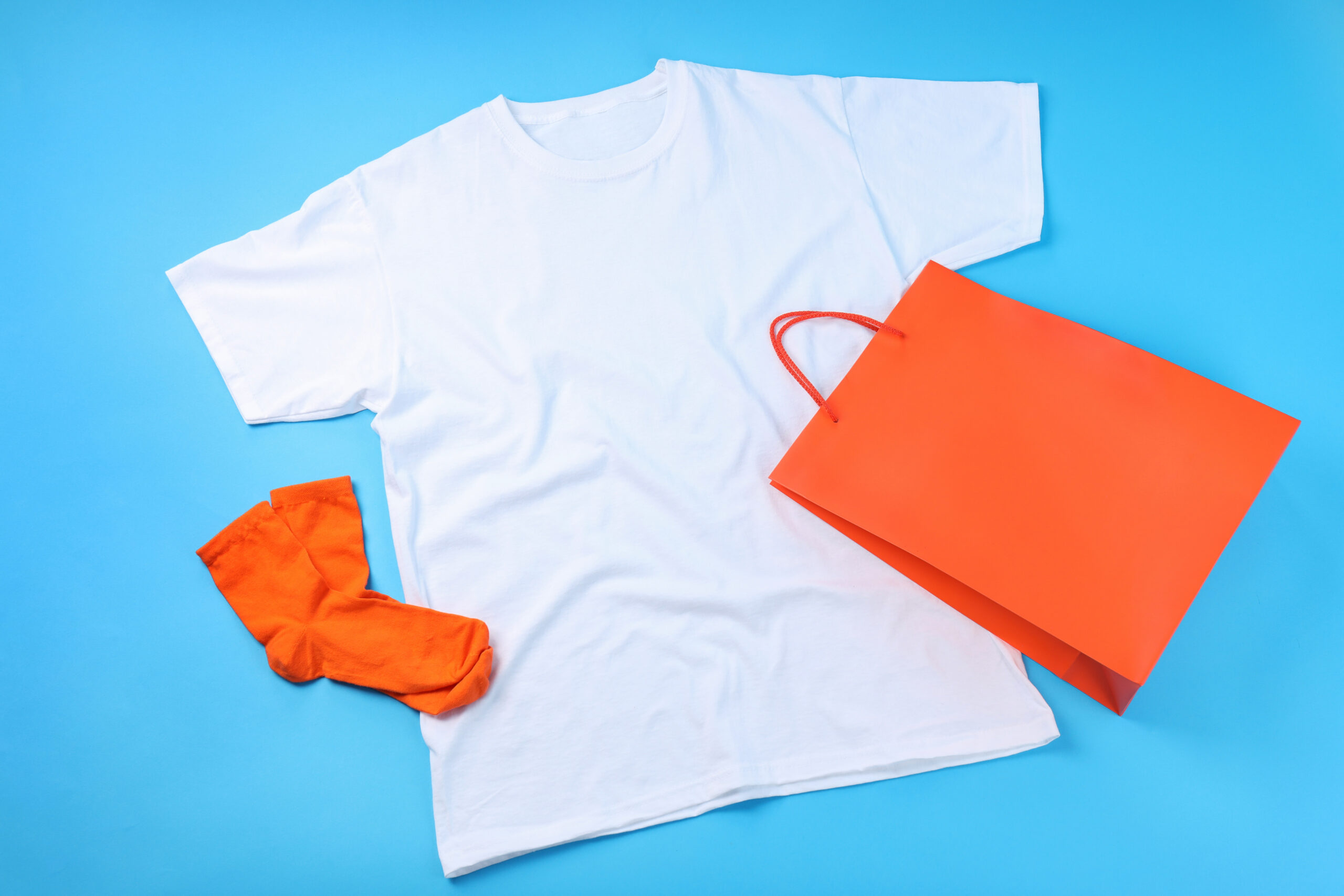 blank t shirt bag and socks on blue background 2026 01 09 07 04 09 utc
