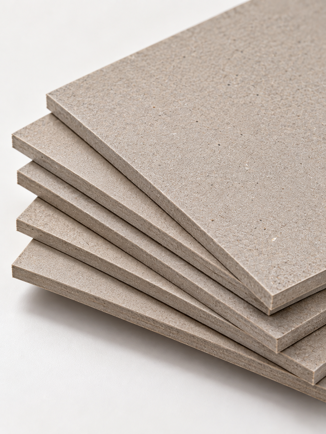 Stacked greyboard sheets
