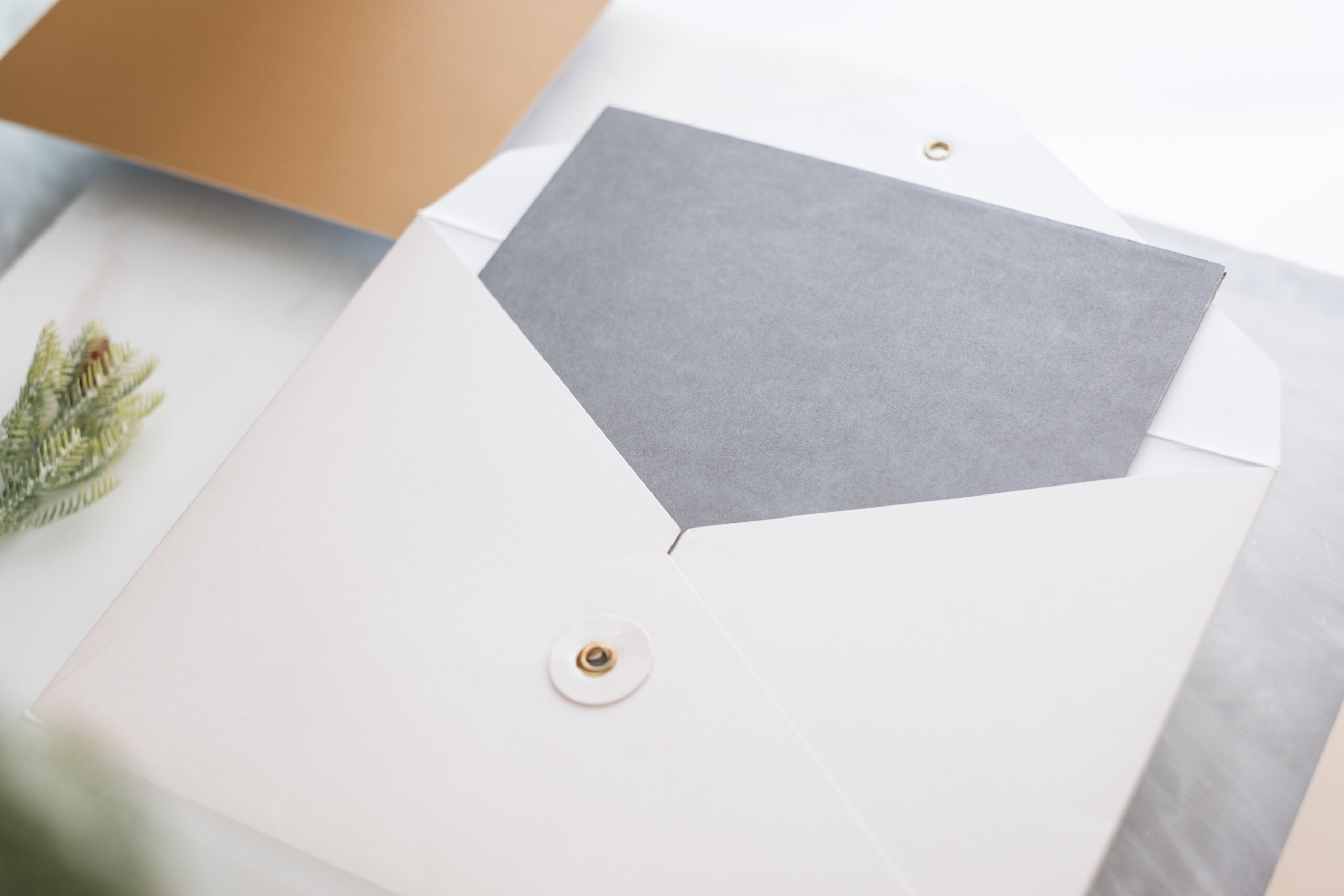 top view of blank grey card in white envelop with 2026 03 13 04 19 46 utc