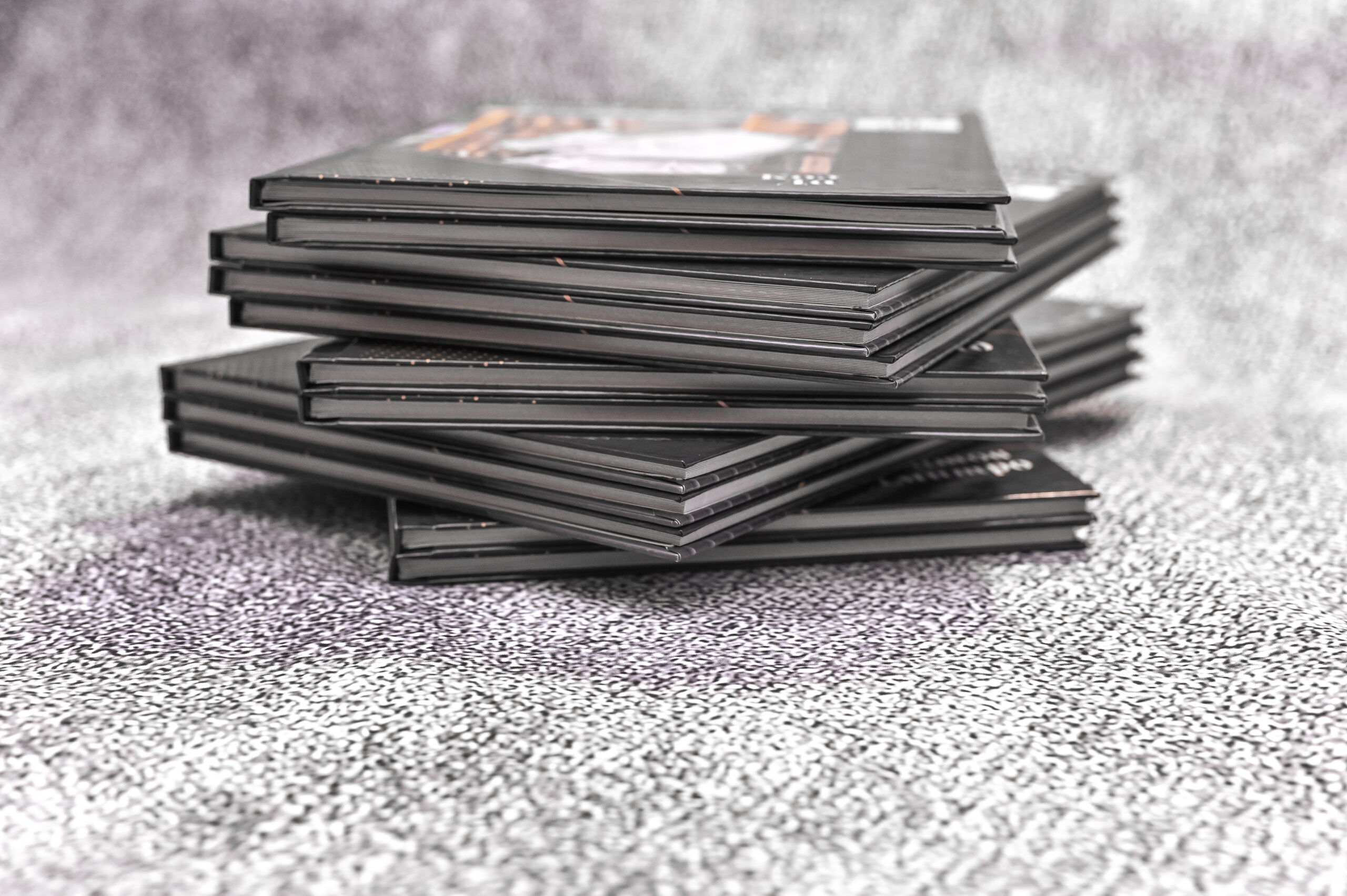 a large stack of paper photo books photo album wi 2026 03 25 06 37 34 utc