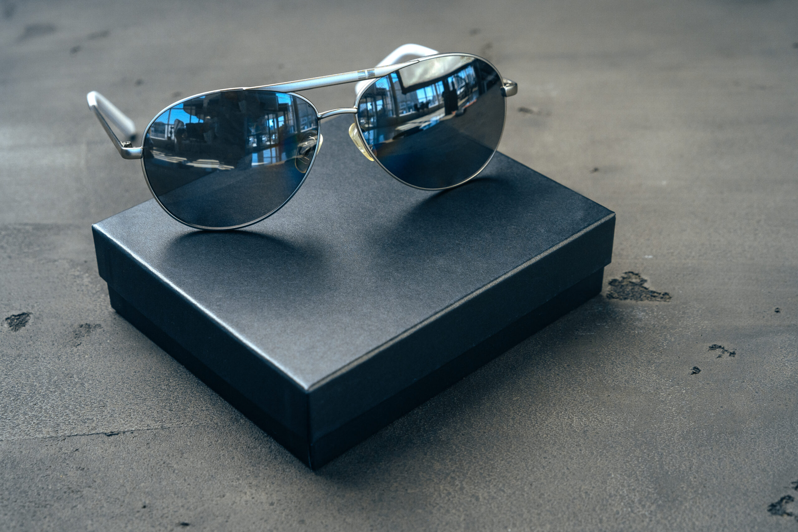 new dark aviator glasses on grey concrete backgrou 2026 01 08 22 37 09 utc