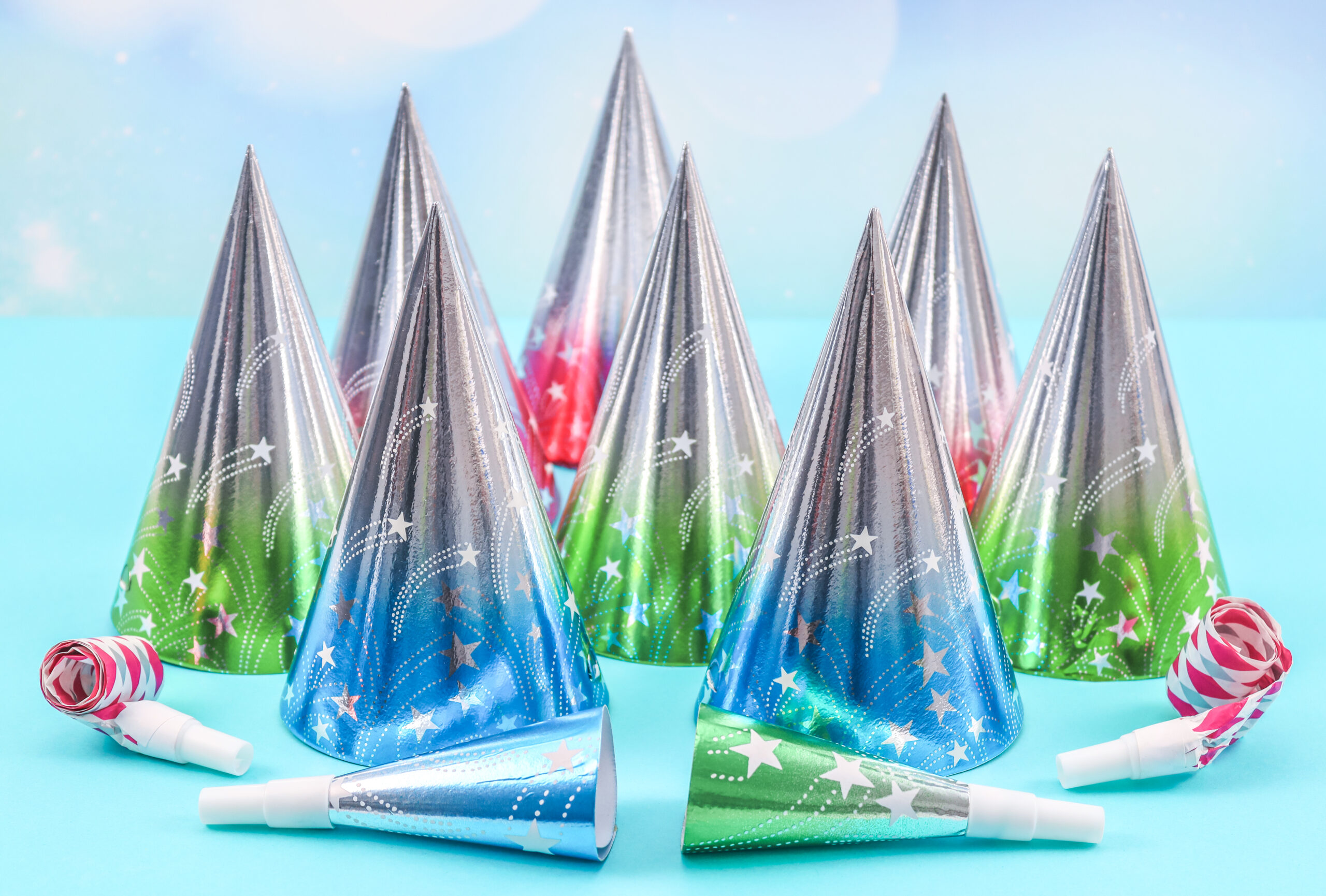 set of cone hats and birthday whistles on a blue b 2026 03 24 10 04 39 utc
