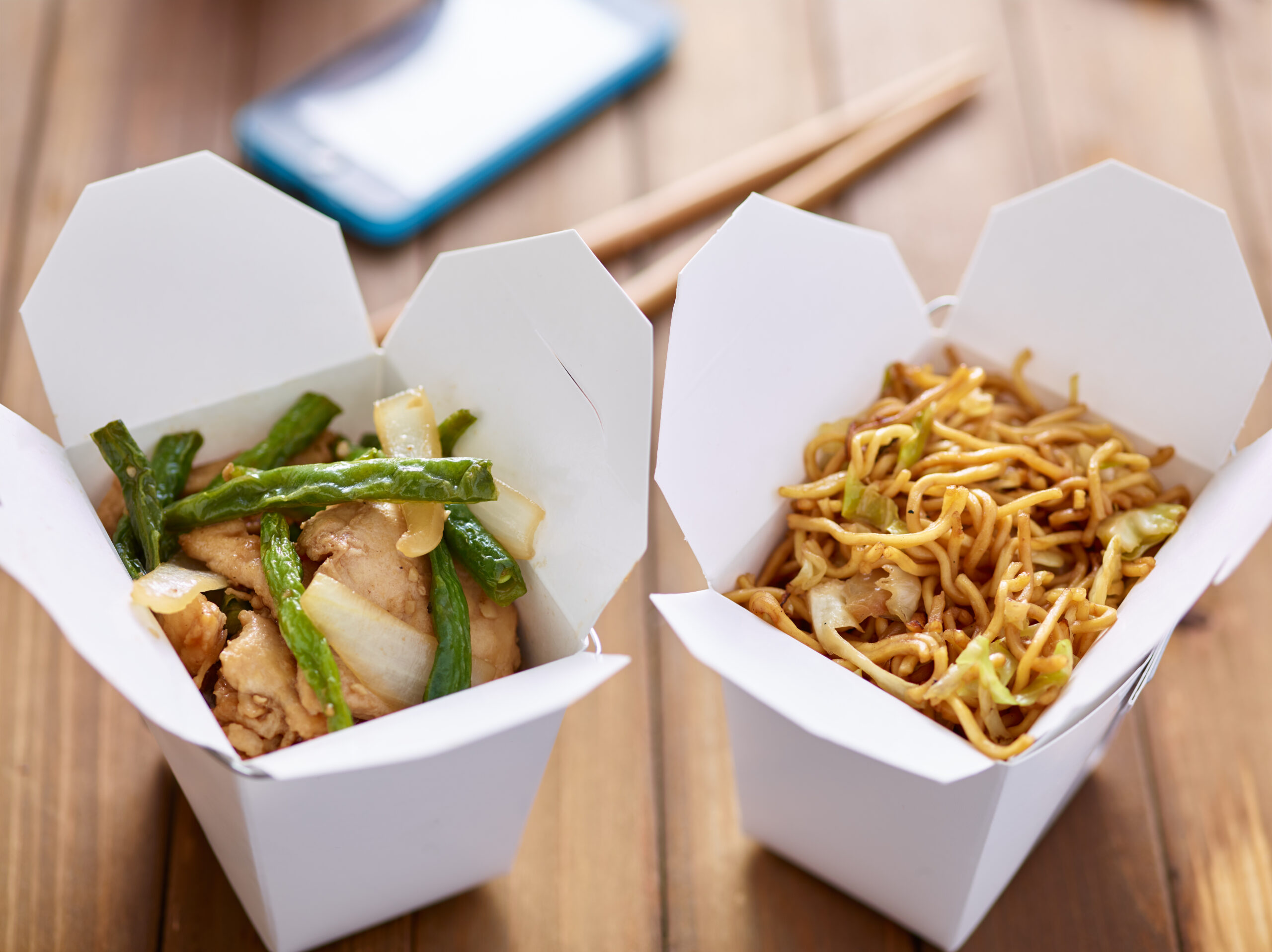 chinese take out food in boxes close up with mobil 2026 01 06 09 57 05 utc