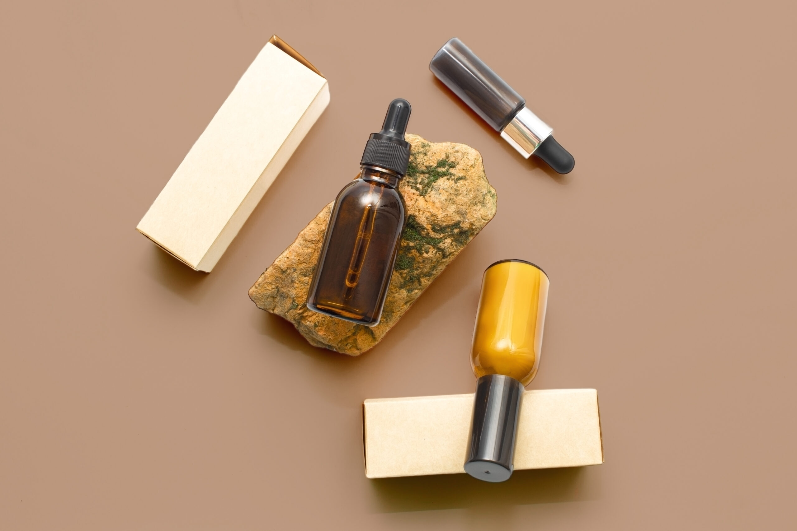 glass cosmetic bottles with a dropper on a beige b 2026 01 06 09 13 59 utc