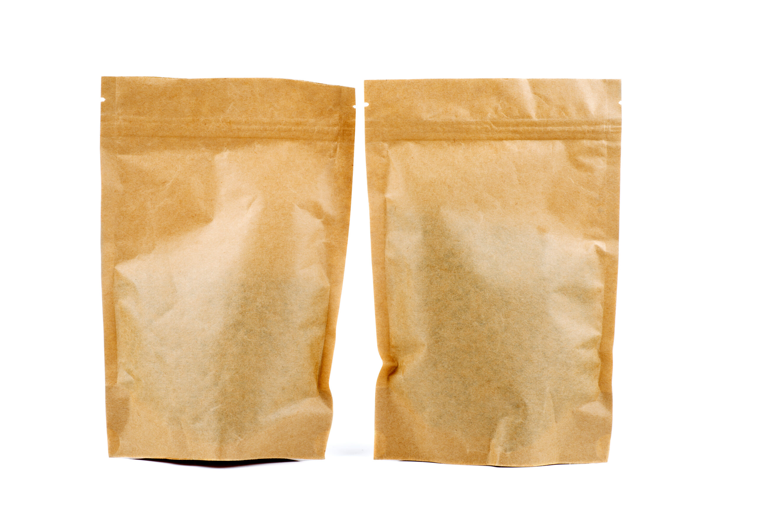 two brown paper packets on a white background 2026 01 11 11 10 51 utc