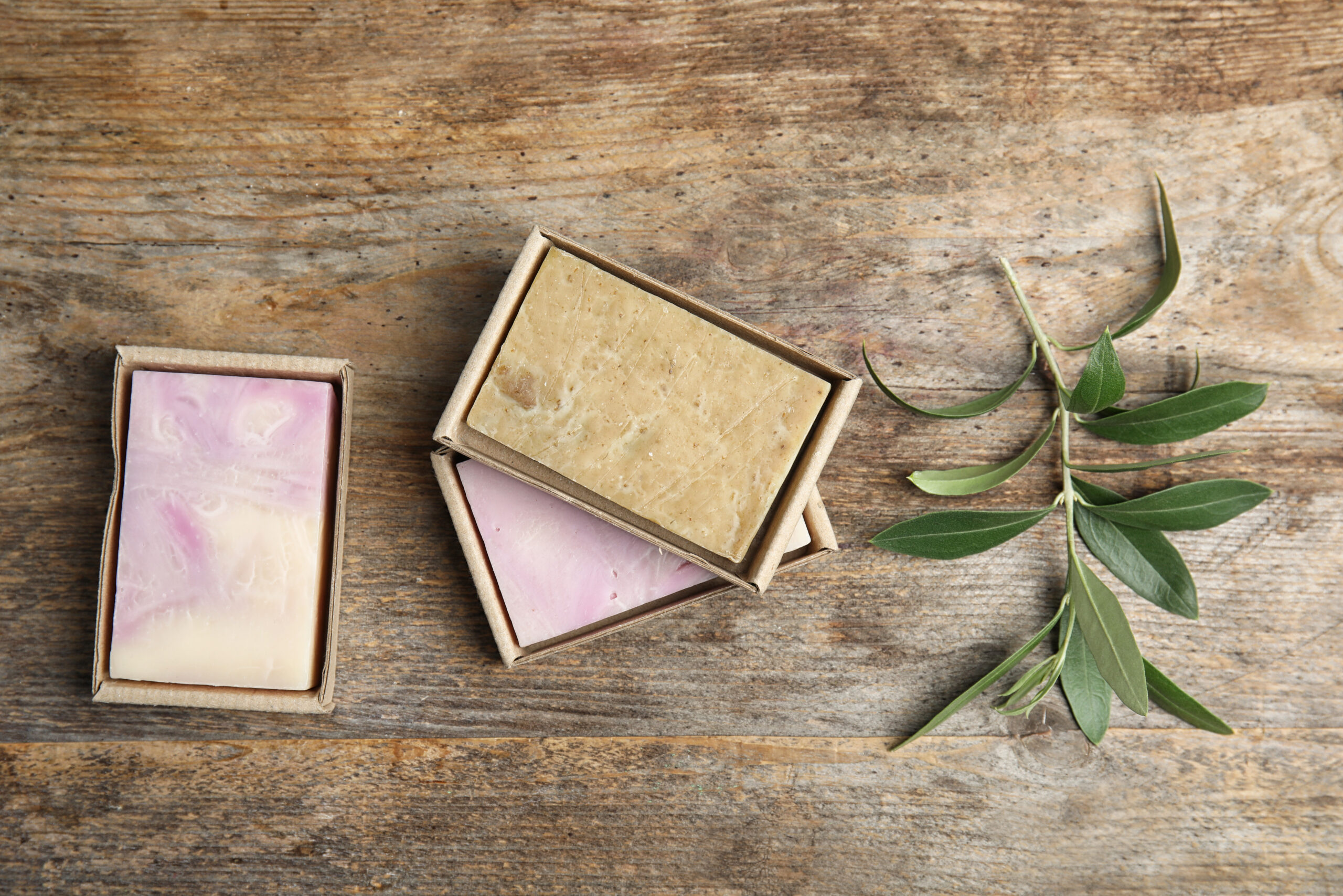 packed handmade soap bars and olive twig on wooden 2026 03 05 11 45 47 utc