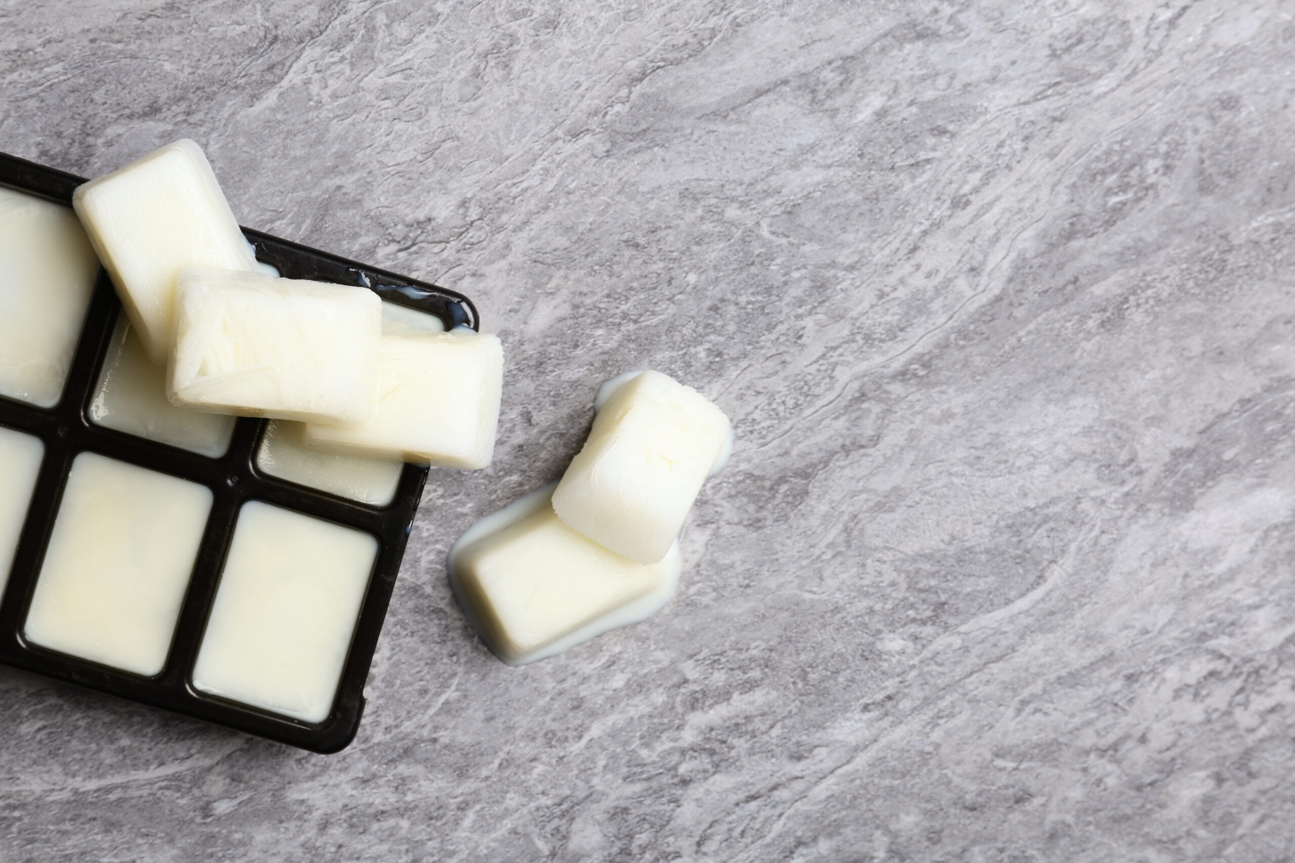 ice cubes made with milk and tray on grey backgrou 2026 02 24 23 45 31 utc