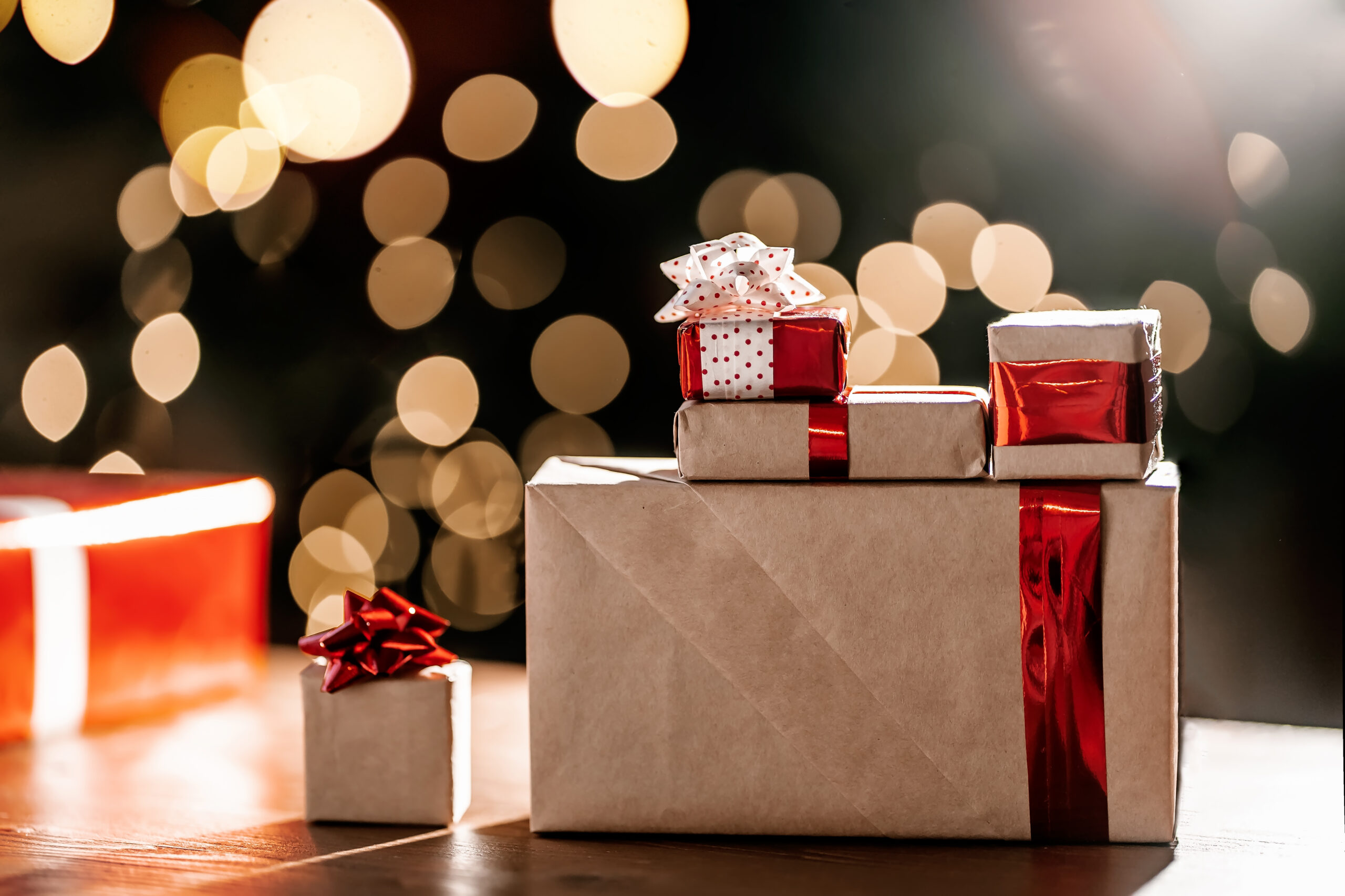 gifts on the background of a christmas tree with a 2026 03 20 00 31 16 utc