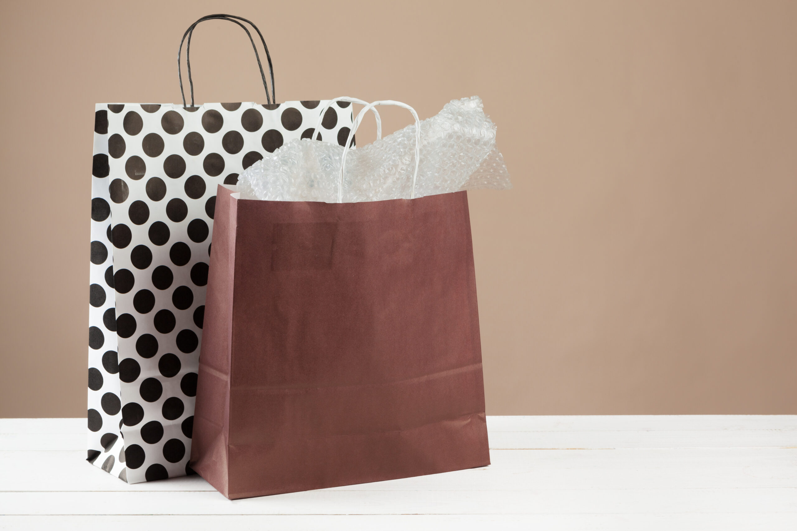 arrangement of shopping bags on beige background 2026 03 24 11 43 20 utc