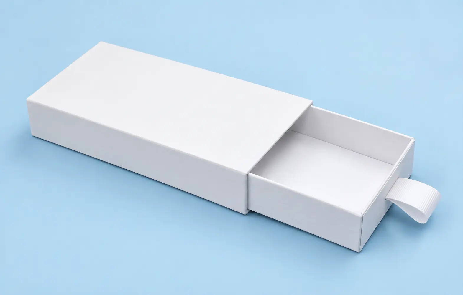 Black presentation gift box with hinged lid open, lilac lining and a purple ribbon band