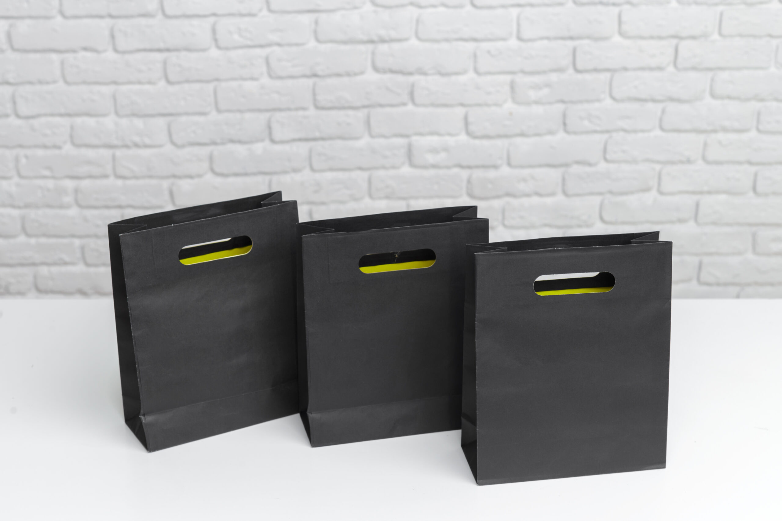 black shopping bags arranged on a surface with a p 2026 02 08 05 53 48 utc