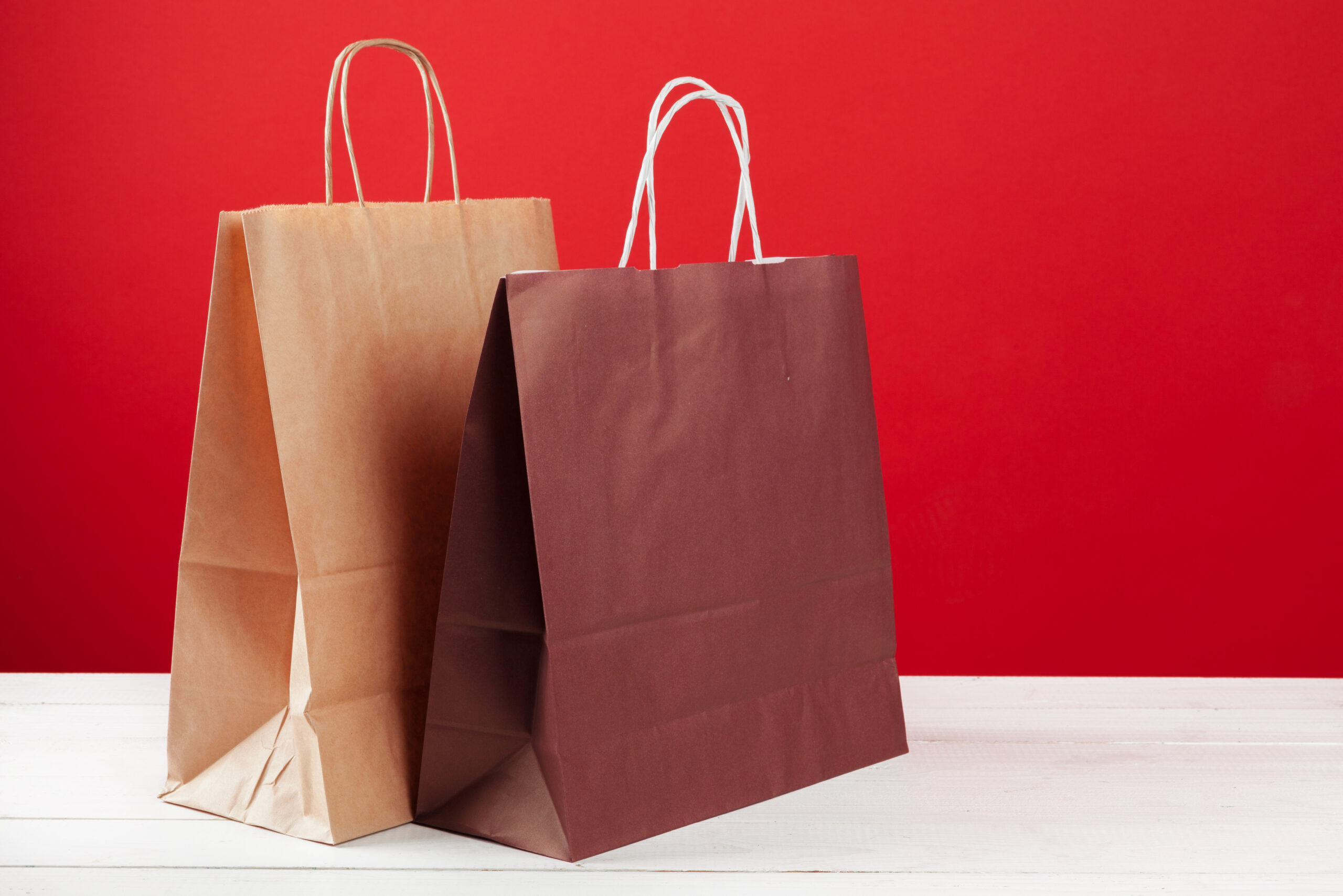 several shopping bags with copy space on red backg 2026 01 08 06 05 01 utc