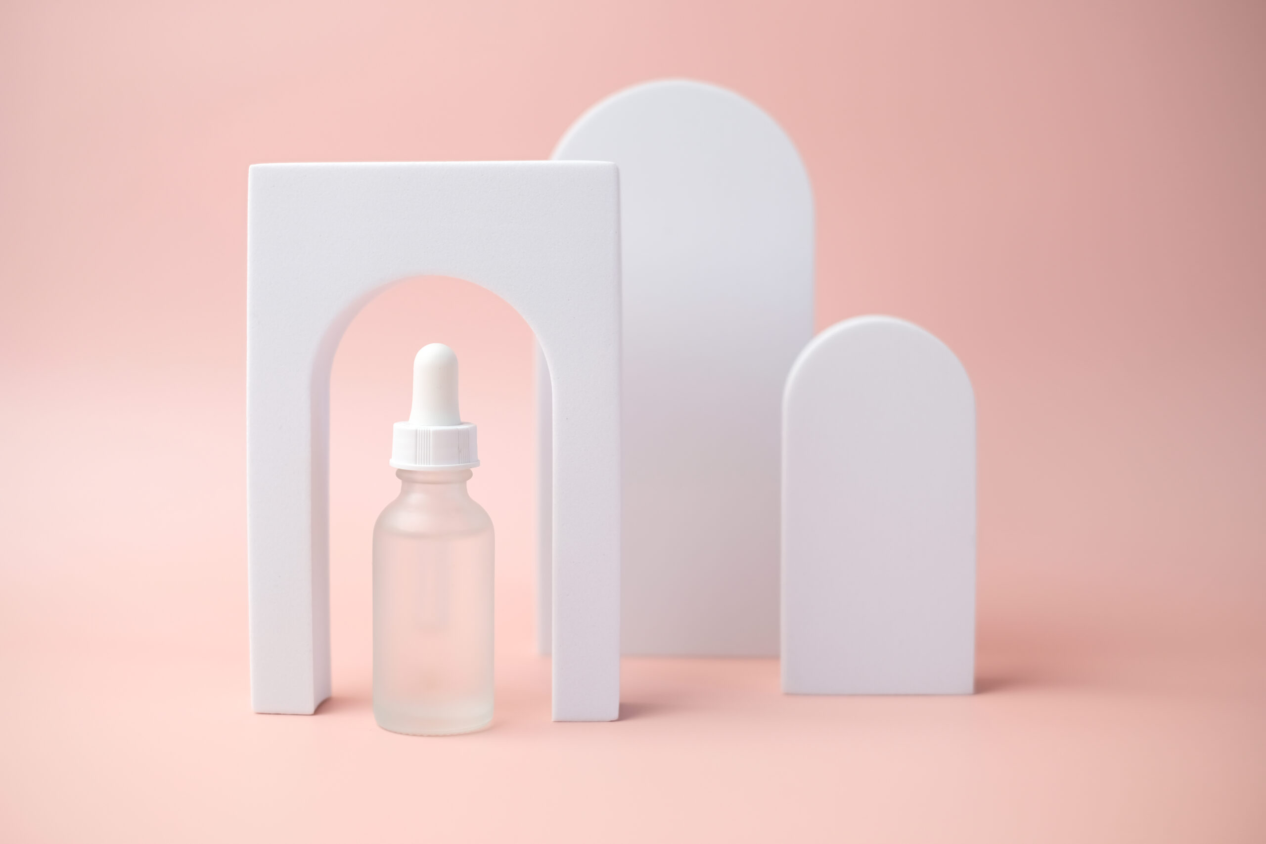 the white skincare dropper bottle is on pink backg 2026 01 07 00 24 00 utc