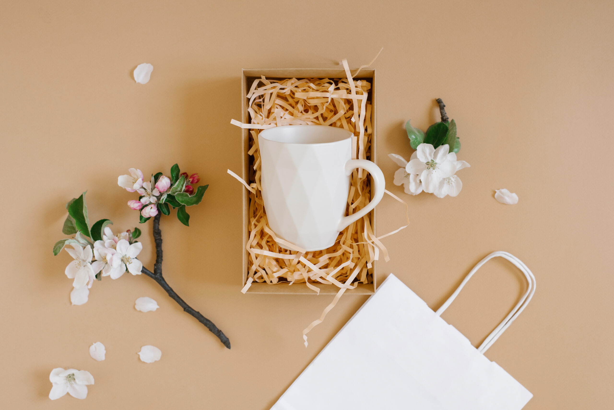 open gift box with peach colored paper shavings co 2026 03 24 07 08 40 utc
