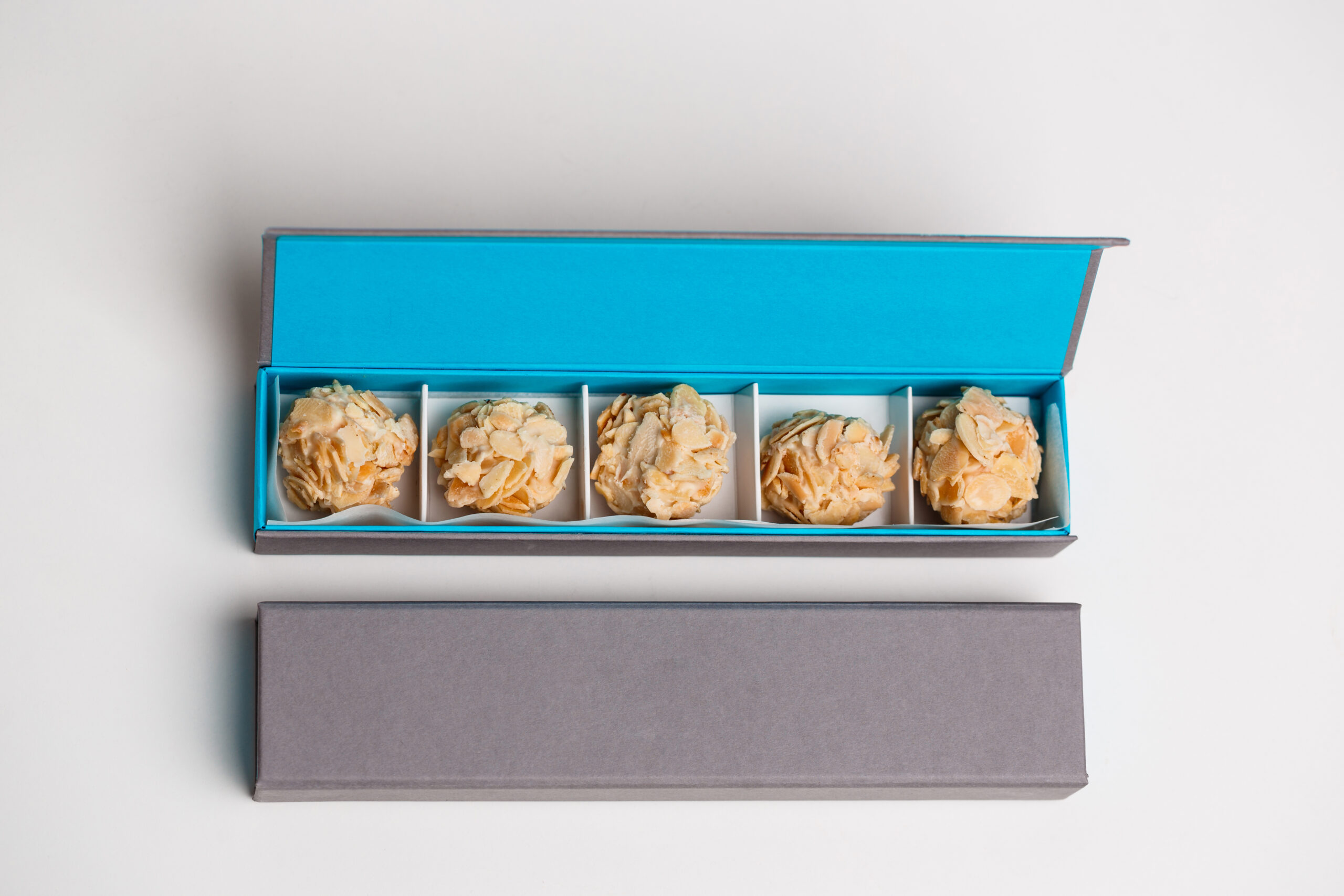 Custom rigid box with die-cut inserts for secure product protection and luxury presentation.