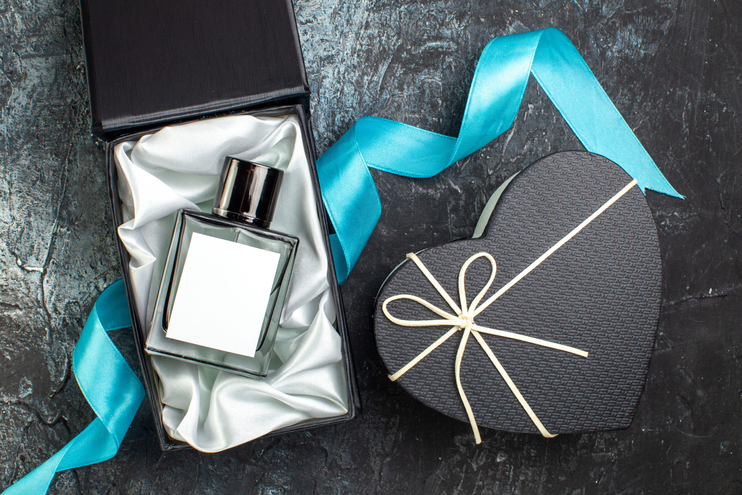 overhead view of blue ribbon on man perfume in a g 2026 03 18 11 51 14 utc