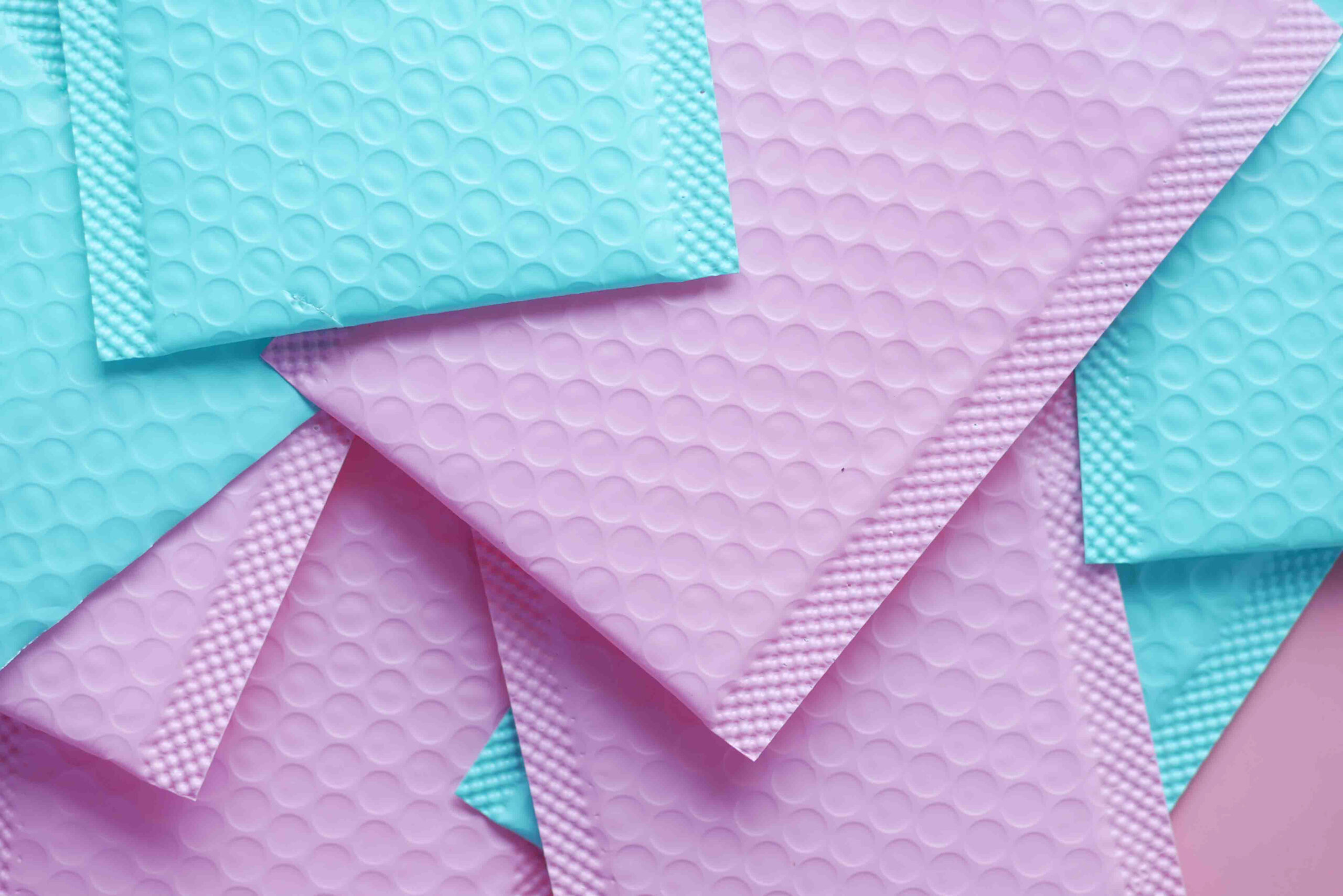 pink and green color paper bubble envelope on tabl 2026 03 16 03 22 40 utc