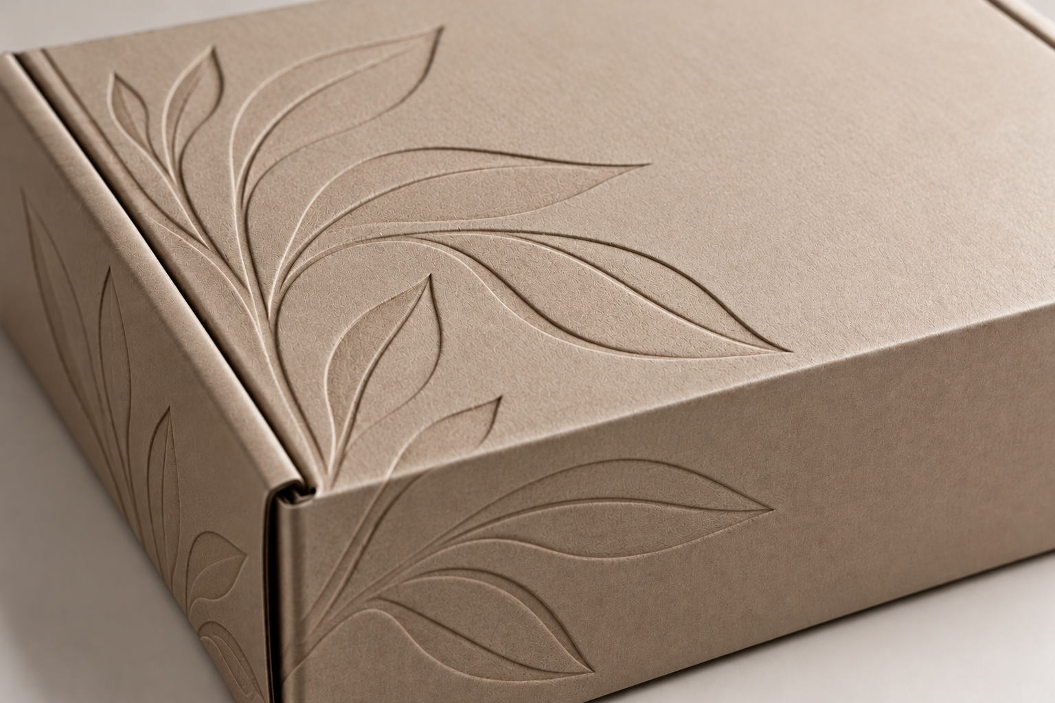 Custom mailer box featuring recessed debossed leaf pattern by Artsy Packaging UK