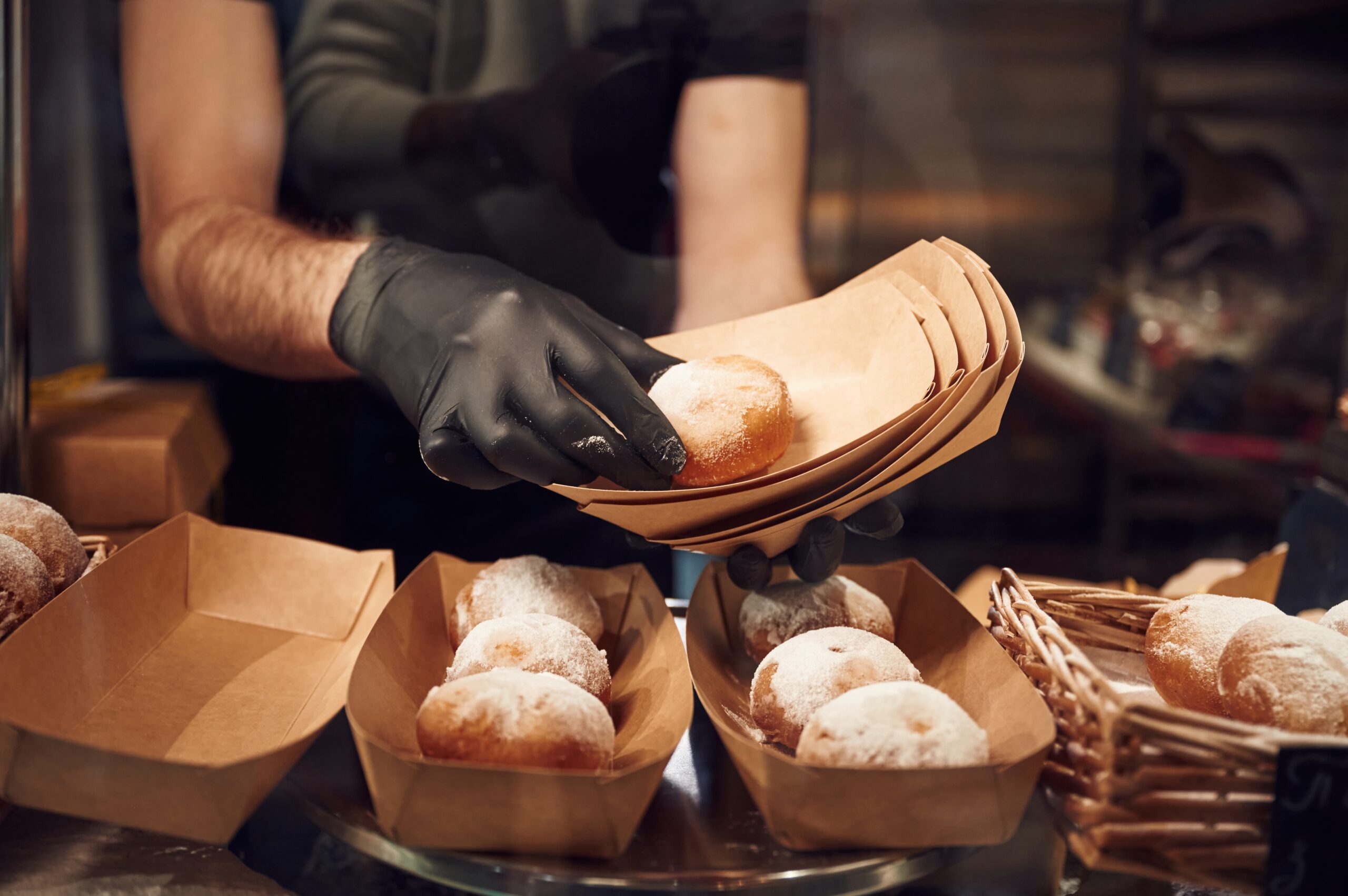 delicious donuts man is taking food in the worksp 2026 03 24 07 07 21 utc