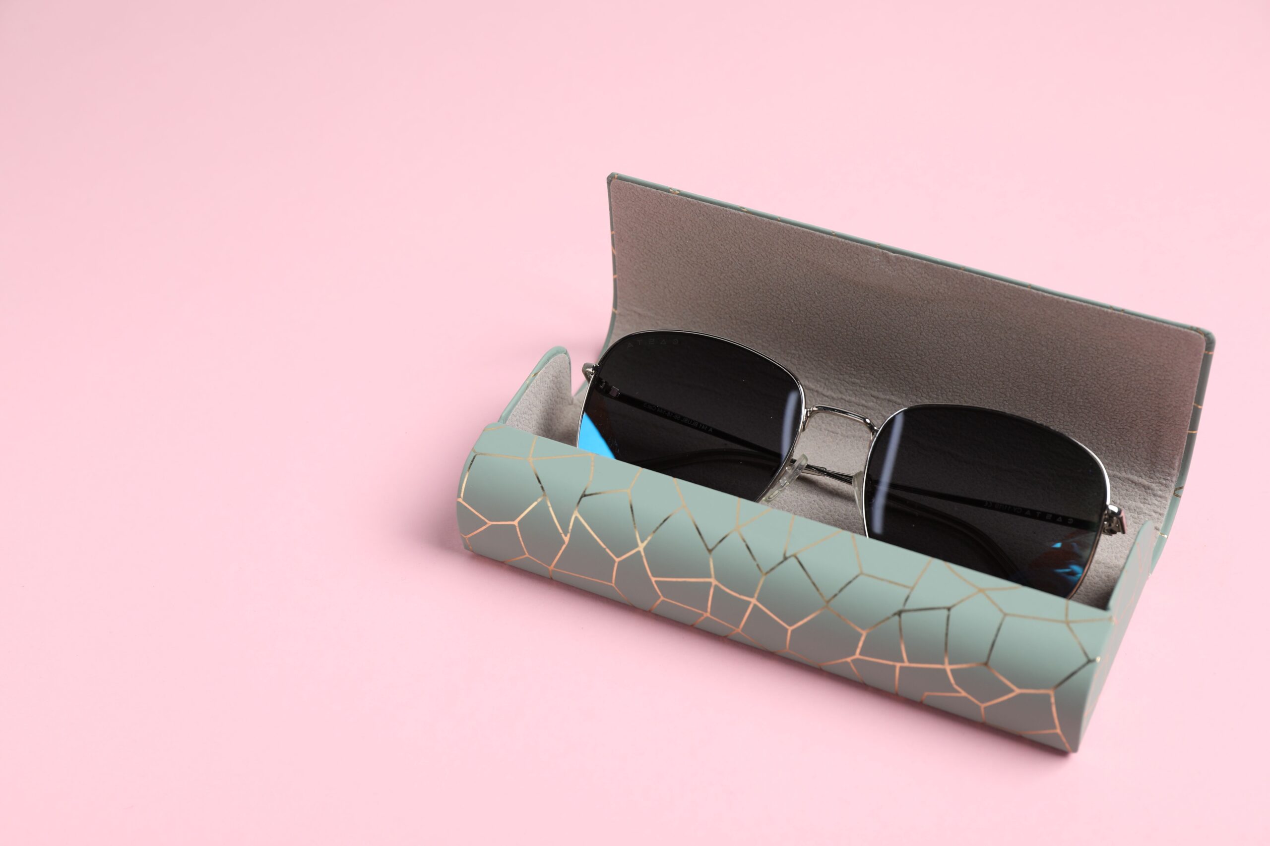 case with stylish sunglasses on light pink backgro 2026 01 11 11 10 19 utc