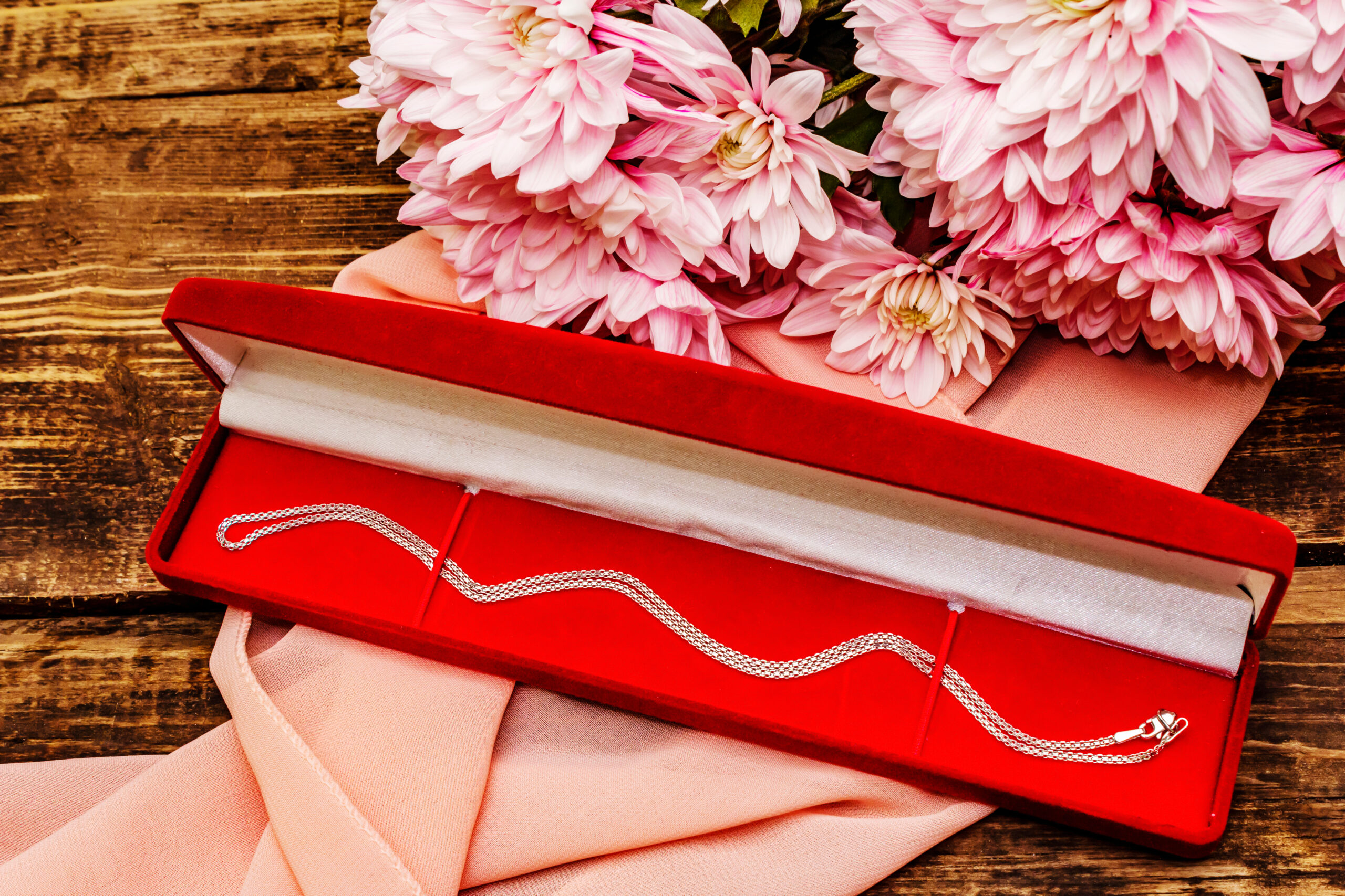 necklace in red box with pink flowers 2026 03 26 05 24 26 utc