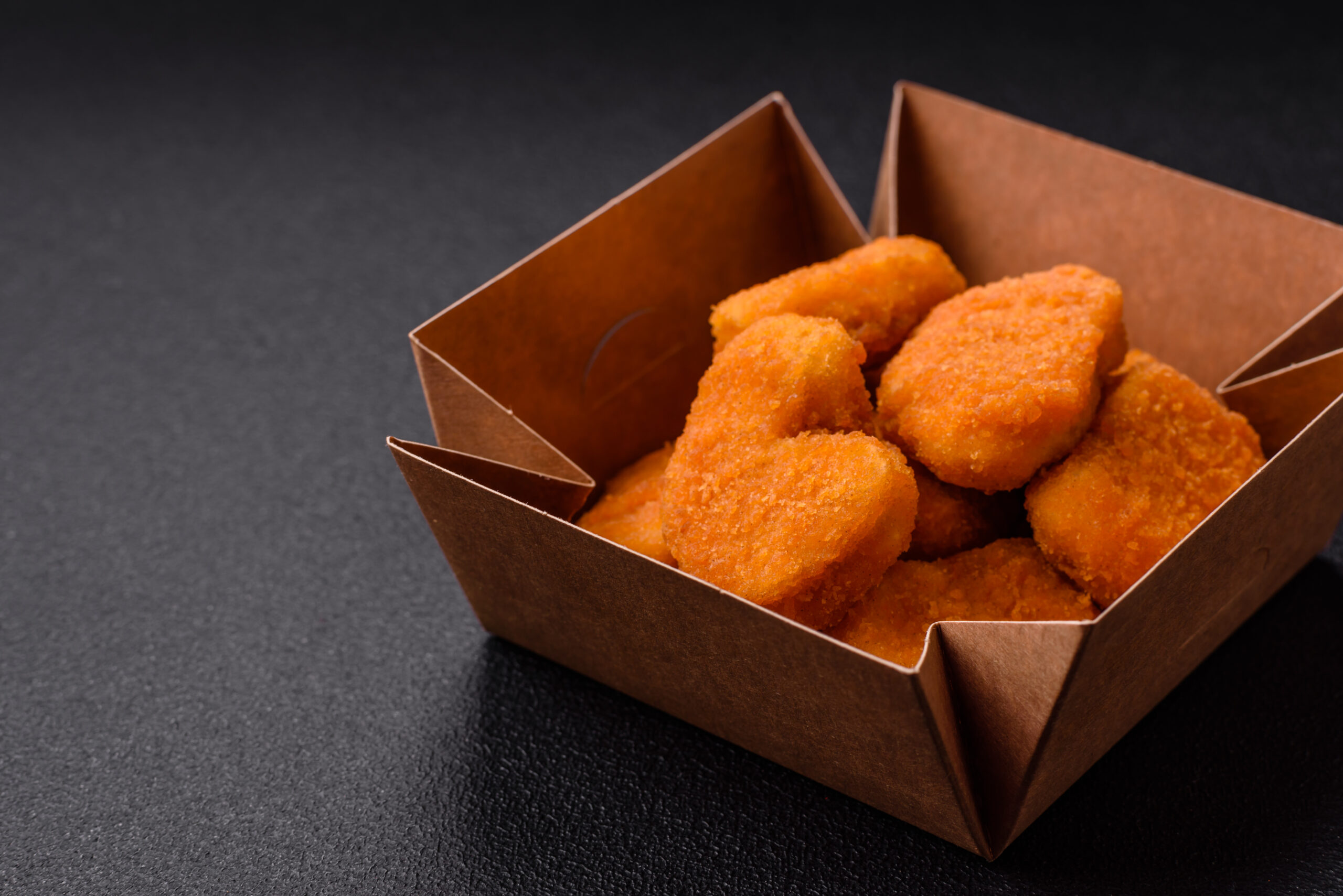 delicious fresh crispy chicken nuggets on a dark c 2026 03 16 03 18 06 utc