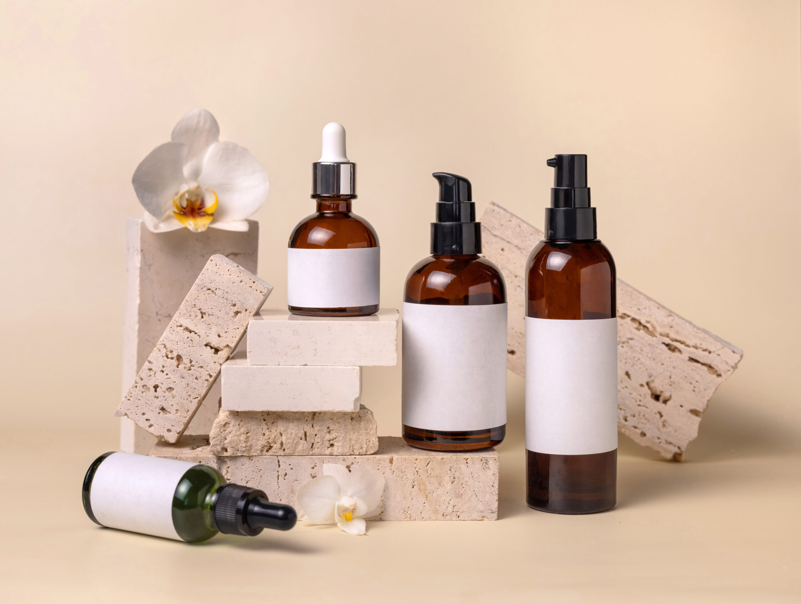 glass cosmetic bottles near white orchid flowers a 2026 03 24 00 30 05 utc