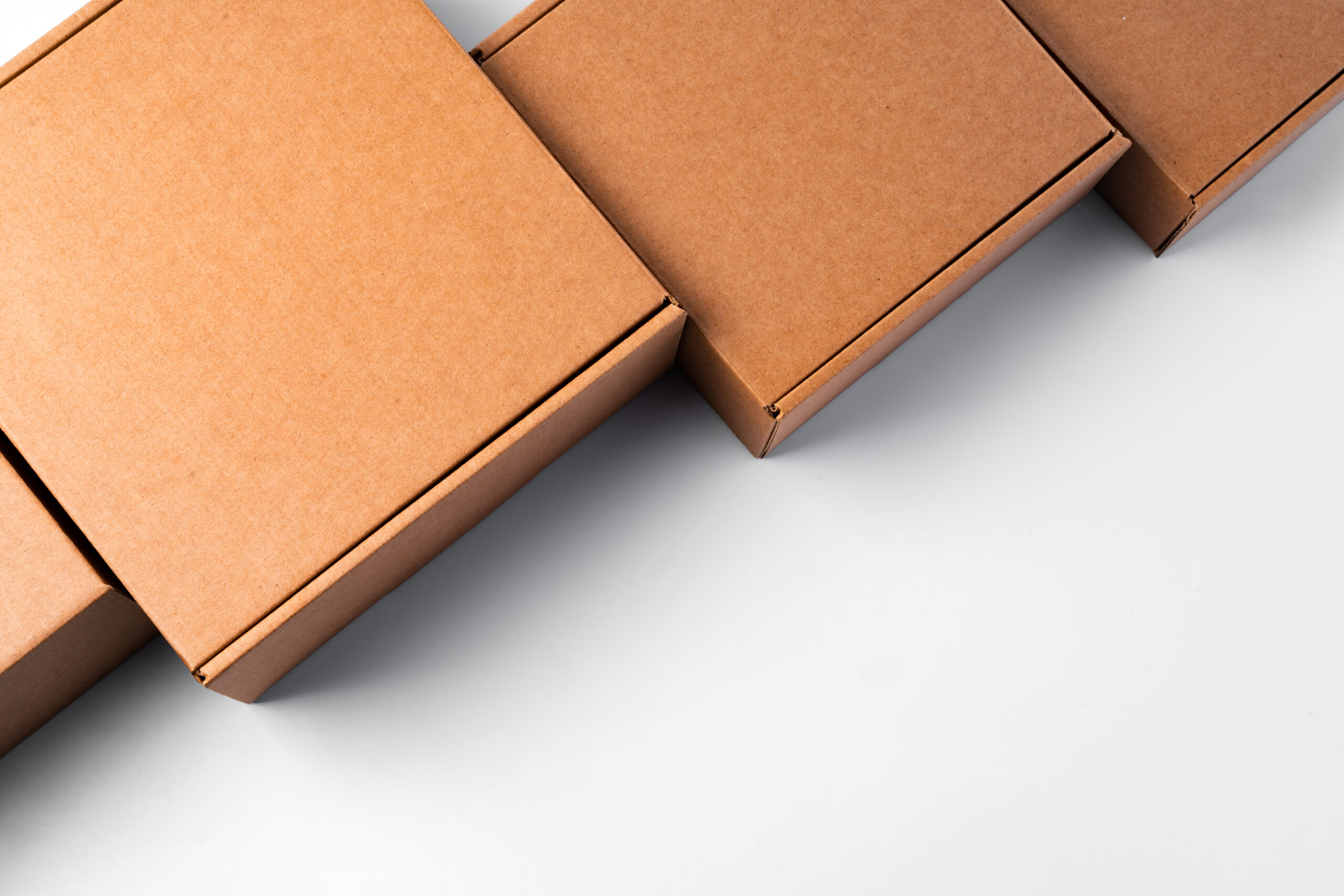 minimalist brown cardboard boxes on white surface 2026 03 20 03 30 09 utc