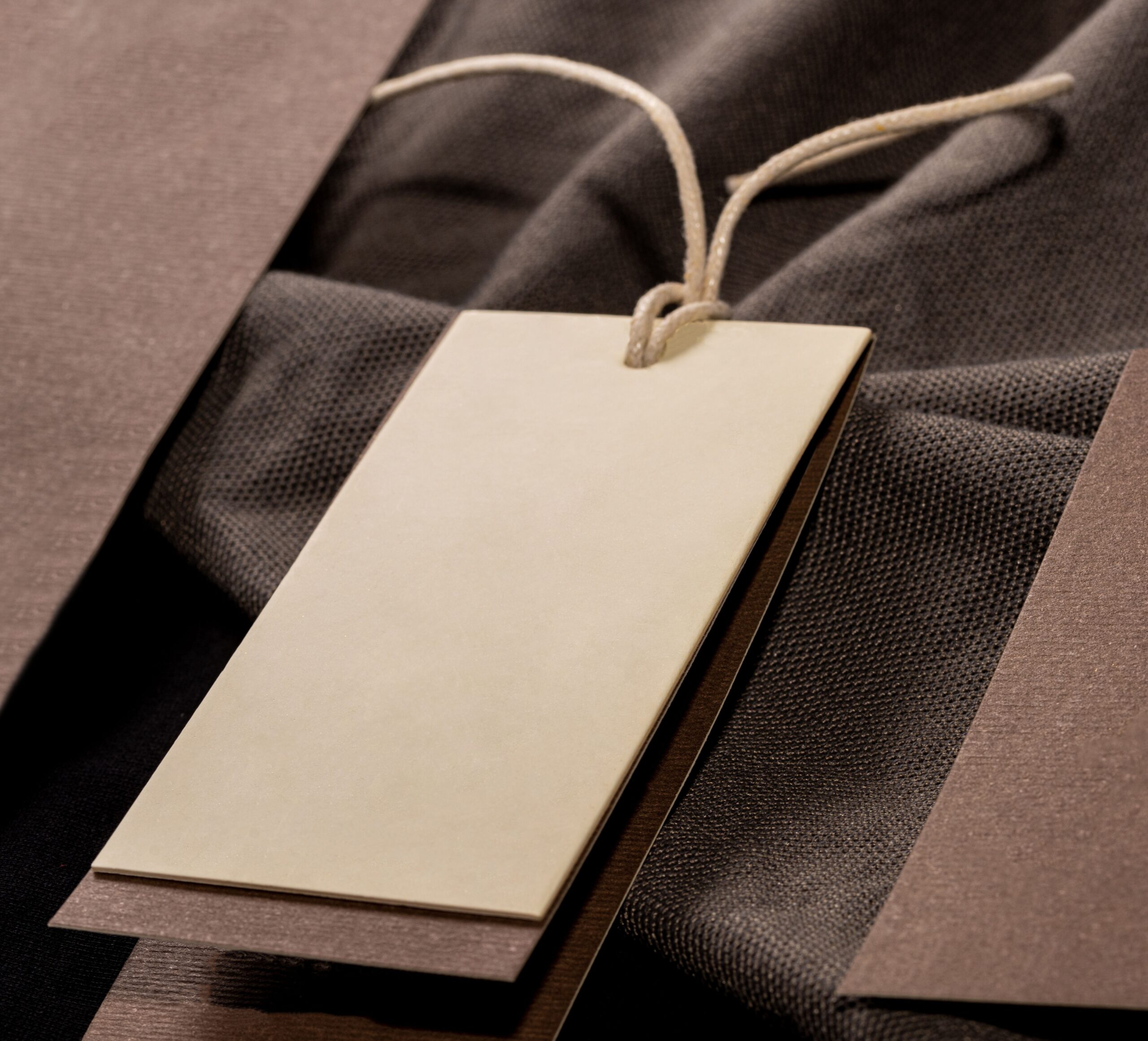 neutral clothing tag with textured fabric backdrop 2026 03 18 07 04 34 utc