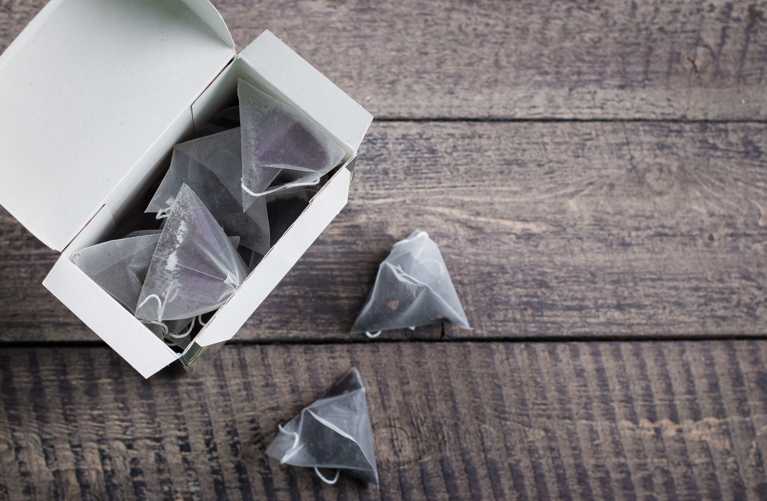 tea bag shape of pyramid in paper packaging box on 2026 03 24 09 01 12 utc