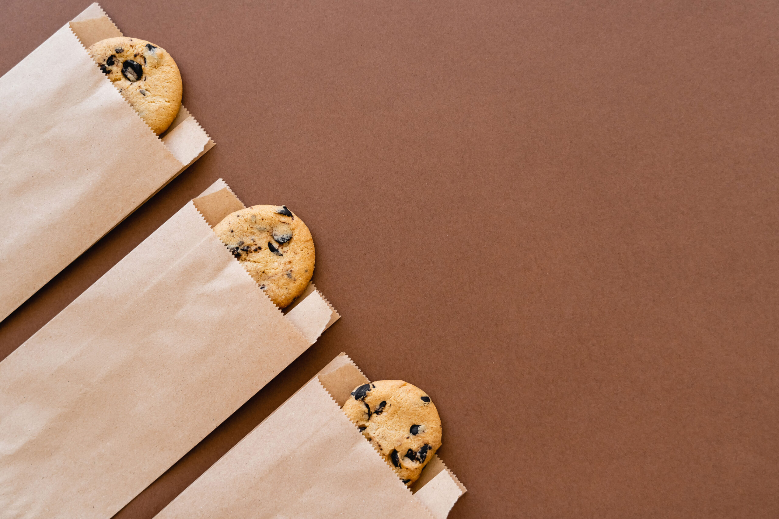 top view of cookies in craft packages on brown bac 2026 01 05 23 40 28 utc