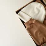 box with beanie and sweatshirt on white background 2026 01 09 07 48 14 utc
