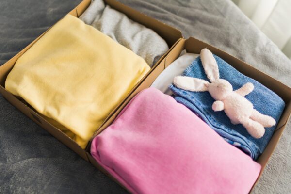 stack clothing for sorting and donation in cardboa 2026 01 06 09 17 12 utc