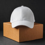 white baseball cap beside cardboard box 2026 01 08 05 45 28 utc