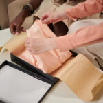 woman unpacking silk pajamas 2026 01 08 00 07 59 utc
