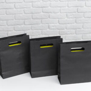 black shopping bags arranged on a surface with a p 2026 02 08 05 53 48 utc