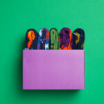 box with socks on green background top view 2026 01 09 08 23 03 utc