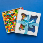 box with sweet chocolate candies on color backgrou 2026 02 01 06 04 49 utc